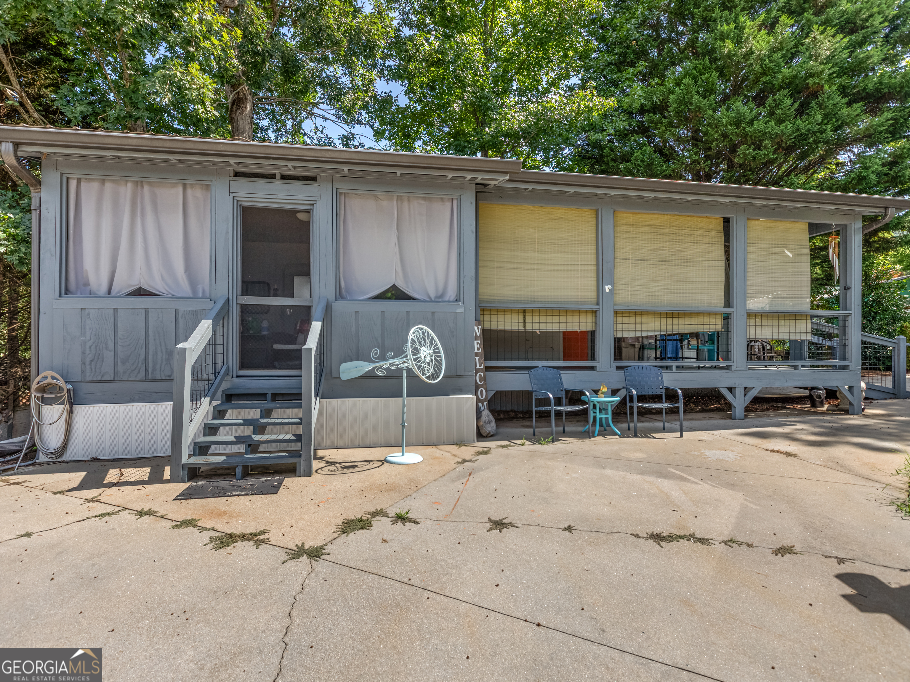 Location, Location, Location - with Unmatched Yonah Mountain Views! Welcome to your beautifully renovated mountain retreat in the heart of Yonah Mountain Resort! This fully updated RV sits on one of the largest and most desirable concrete lots in the community, offering 365-day/year-round unobstructed views of iconic Yonah Mountain. Enjoy modern upgrades completed less than two years ago, including new stainless steel kitchen appliances, high-efficiency mini-split HVAC system, new shower, washer/dryer hookups, and a custom platform bed with built-in storage. The built-in sofas easily convert to beds for guests. Outside, a full metal roof covers both the RV and the spacious partially screened-in front porch, ideal for relaxing or entertaining. A charming gazebo adds to the outdoor living space, and the large shed with full electric is perfect for golf cart parking or extra storage. Situated just 5.3 miles from downtown Helen and ideally located between Cleveland and the area's best wineries, hiking trails, and waterfalls, this property offers a true slice of mountain paradise. As part of the Yonah Mountain Resort community, you'll enjoy access to amenities including a pool, playground, basketball court, and clubhouse. Don't miss your chance to own this unique property with stunning views and thoughtful updates-come see it today!