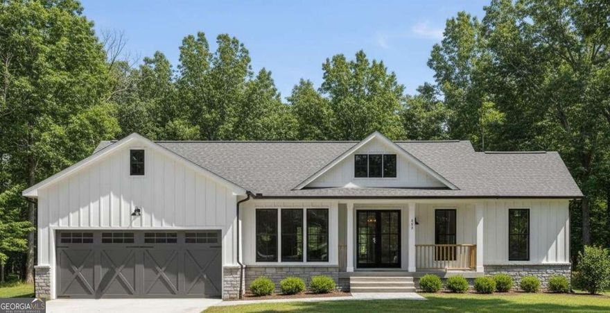 Brand new construction ranch-style on 3.02 acres in Locust Grove offering the perfect mix of modern comfort and country charm! This thoughtfully designed 3-bedroom, 2-bath home includes an additional flex room that can be used as an office or guest space, plus a spacious oversized 2-car garage with a dedicated storage room. Step inside through the elegant double-door entry and enjoy the ease of single-level living with soaring 10 ft ceilings, light brown wood flooring in the main living areas, and an open concept layout ideal for entertaining. The chef's kitchen features bold blue cabinetry with quartz countertops, a large island with a farmhouse-style chandelier, a walk-in pantry, and direct flow into the family room highlighted by a cozy fireplace with custom wooden shiplap. The primary suite is a private retreat complete with tray ceilings, a feature wall with molding for added character, and barn wood doors leading to a spa-like bath with his-and-hers vanities, soaking tub, and separate standing shower. Secondary bedrooms are carpeted for comfort and share a beautifully finished full bath. A spacious walk-in laundry room adds convenience, while outdoor living is elevated with a huge covered back patio perfect for gatherings and enjoying peaceful evenings. This home is equipped with a brand new 1-horsepower well pumping 10 gallons per minute (no city water) and a brand new 1,500-gallon septic tank system, ensuring long-term efficiency and reliability. With excellent utilities, privacy, and plenty of land to spread out, this ranch home is a rare find in today's market-offering brand new construction on acreage with designer finishes and timeless appeal. Estimated Completion for November 2025.