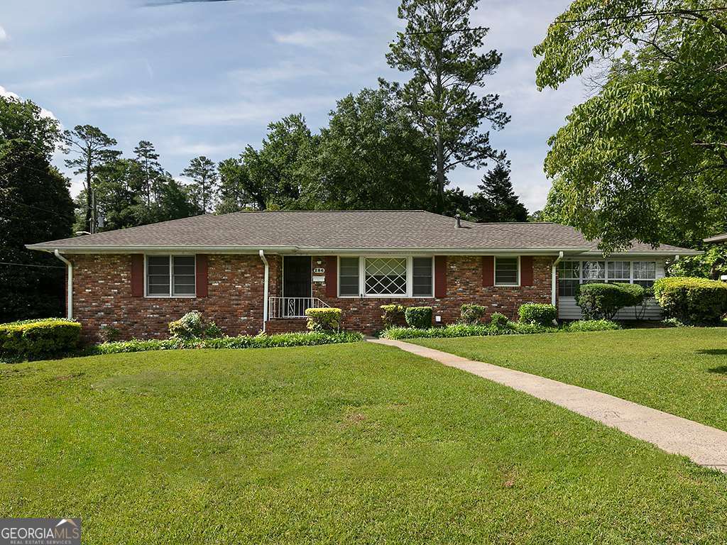 Welcome to this inviting 3-bedroom, 2-bathroom brick ranch located in the desirable Kennestone Heights neighborhood-just minutes from the Marietta Square, Kennestone Hospital, and I-75. Nestled on a quiet street with no HOA, this home offers the perfect blend of comfort, convenience, and potential. Step inside to discover a spacious living room with a cozy fireplace, a separate den, and a bright sunroom that brings the outdoors in. The home features a 2-car garage, an unfinished basement with endless possibilities, and classic ranch-style living on one level. Situated in a peaceful, well-established community and zoned for excellent schools, this property is ideal for homeowners and investors alike. Whether you're looking for your forever home, a renovation opportunity, or a short-term rental investment, this one checks all the boxes! Don't miss your chance to own in one of Marietta's most convenient and charming locations. Home is being sole in "as is" condition.