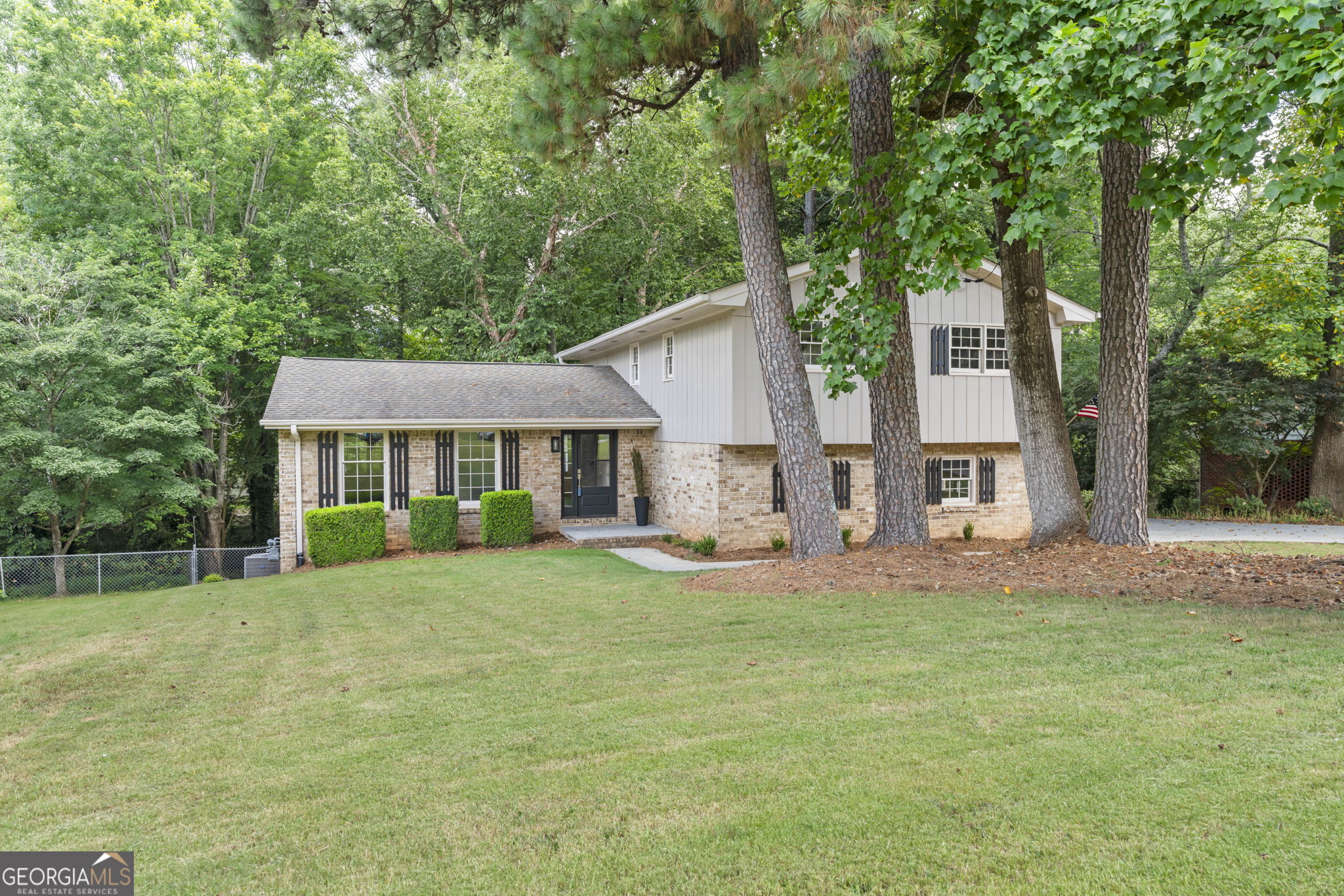 Welcome to your dream home! This beautifully renovated 4-bedroom, 2.5-bath gem perfectly blends modern style and comfort and is nestled in the desirable Lockridge Forest Swim and Tennis neighborhood. Enjoy the spaciousness of generously sized bedrooms, each flooded with ample natural light. Luxurious baths feature new quartz countertops, stylish vanities, custom tile, and upgraded lighting fixtures, ensuring a spa-like experience at home. The heart of the home boasts new hardwood floors, sleek quartz countertops, upgraded appliances, and new cabinets in the kitchen, making cooking a true pleasure. Open-concept living and dining areas are enhanced with upgraded lighting, creating an inviting atmosphere for entertaining or relaxing. Explore the newly renovated laundry and half-bath, or head down to the walk-out basement for extra space to suit your needs. Step through your new French doors to a spacious, screened-in porch featuring new tiles, complemented by a well-maintained fenced yard, perfect for outdoor gatherings or simply unwinding after a long day. This home is situated in a sought-after community, offering easy access to shopping, dining, parks, and schools, making it a convenient choice for any homeowner. Lockridge Forest Swim & Tennis offers a range of amenities to ensure you're living the lifestyle you prefer. They are a members-only club with a newly restored Junior Olympic Swimming Pool, large enclosed & gated wading pool for babies and toddlers, and professionally managed and certified lifeguards during swim season. There are four lighted tennis courts available for ALTA, USTA, and T2 tennis teams, as well as pick-up matches year-round. Members can reserve courts online or via mobile. There are numerous social events throughout the year for all ages, and the Taj Mahal and Pavilion facilities can be reserved for special occasions and parties. Make grilling out this summer a weekly family event! All of this is nestled within a private 9-acre park-like setting featuring hardwoods and pines, as well as a vast picnic and playground area with swing sets, playhouses, and picnic tables. Grab some sun on the pool deck or picnic on the lawn! Don't miss the opportunity to make this stunning Dunwoody home yours! Schedule a showing today and experience all the modern conveniences and stylish upgrades this property has to offer, ensuring comfort and convenience.