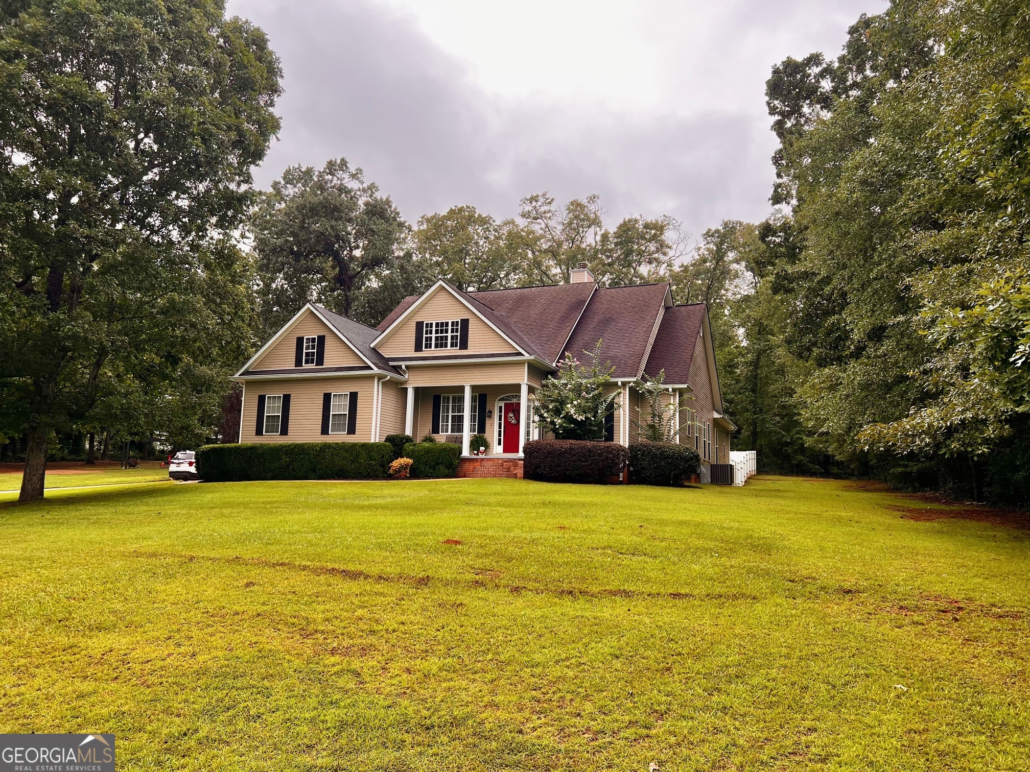 Immaculately kept home in desirable Western Upson County on 5.77 acres has 4 bedrooms and 3 full bathrooms (two bedrooms have their own private bathroom). Master suite with separate vanities, jacuzzi tub, separate shower, and separate walk-in closets has its own access to the large covered back porch overlooking the fenced back yard. Vaulted ceiling in the living room and a fireplace within view from the dining room and the breakfast area. Good size kitchen with white cabinets, snack bar, and appliance package. Hardwood floors, architectural shingled roof, double garage, and a barn are among the many features you'll love. Mores pics coming soon.