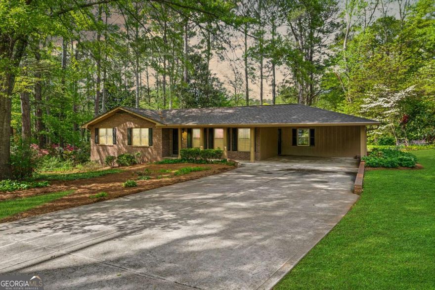 Your East Cobb Escape Awaits!    Tucked away in a quiet East Cobb cul-de-sac, this stunning 4 bedroom true ranch offers a unique blend of modern amenities, classic style, and private outdoor space, all without the burden of an HOA.    As you step inside, you'll be greeted by the warm, natural light that fills the open-concept living area. Rich oak hardwood floors flow seamlessly throughout the main level, connecting the spacious living and dining rooms to a beautifully updated kitchen. Completed in 2025, this kitchen renovation features quartz countertops, stainless steel appliances, a breakfast bar, and sleek white cabinetry. Perfect for cooking, entertaining, or enjoying a quiet morning.    A cozy family room with a fireplace sits just off the kitchen, accompanied by a convenient laundry area. The primary bedroom boasts an updated en suite bath, while two large secondary bedrooms offer generous closets and plenty of natural light. An updated hallway bath completes the main level.    Downstairs, the finished walk-out basement offers a world of possibilities, featuring a bright bonus room, a fourth bedroom that could serve as an office or gym, and a handy workshop.    Outside, you'll find a peaceful, landscaped backyard retreat perfect for outdoor activities, gatherings, or relaxation.    With its prime location near top schools, major highways, parks, and shopping, this home offers the perfect balance of tranquility and convenience.    This is a rare opportunity to own a worry-free, move-in-ready home in a highly sought-after location. Don't miss your chance to make it yours.