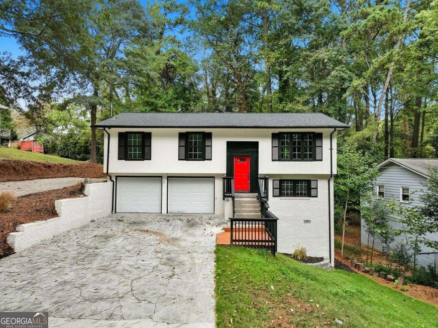Experience refined living in this beautifully renovated four-bedroom, three-bath on a FINISHED BASEMENT showcasing a sophisticated modern farmhouse design. Thoughtfully crafted interiors feature open living spaces and curated finishes that create an effortless blend of comfort and style. Enjoy a peaceful outdoor terrace framed by mature trees and the convenience of two separate driveways providing ample parking. Ideally situated near I-285 and just minutes from local shopping, dining, and parks, this home offers both elegance and accessibility in a truly desirable setting.