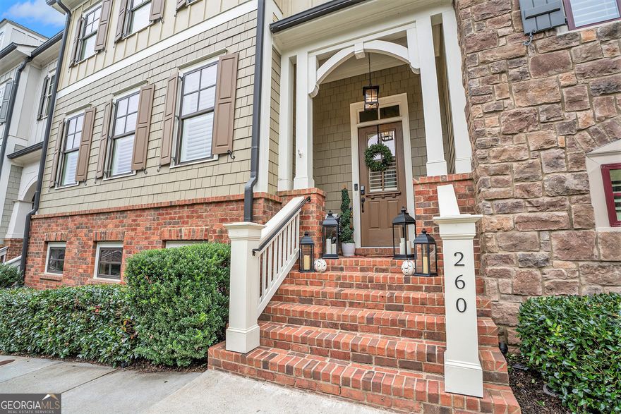 Welcome to this stunning townhome in Overlook at Sixes! Easy living with elevator to all 3 levels.  Enjoy the view of green space from your private back porch, ideal for entertaining. The exterior features a blend of brick, board and batten, and shake, complemented by a charming alcove that leads to the front stoop. Upon entering, you are greeted by a welcoming foyer that opens into a spacious open-concept floor plan with beautiful hardwood floors and crown molding. The Great Room features a coffered ceiling and a stone fireplace framed by elegant archways leading into the dining room. The gourmet eat-in kitchen is a chefCOs dream, showcasing white custom cabinets, stone countertops, a gas cooktop, stainless steel appliances, and an oversized stained island with seating for four. A breakfast area completes this inviting space.  Upstairs, a loft/flex space provides a secondary living room. The primary bedroom is a true sanctuary, featuring a tray ceiling, a large walk-in closet, and an ensuite bathroom with an oversized dual vanity, shower, and separate water closet. Two additional bedrooms share a full bath, and a convenient laundry room is also on the upper level.  The walkout basement remains unfinished, offering endless possibilities for your personal touch. The two-car garage on a private alleyway is equipped with an electric charging station. Upgrades throughout, this home harmoniously blends luxury and practicality in every detail.aThe community amenities include a clubhouse, fitness center, and pool. This property offers the option to join the Brigemill Athletic Club, which includes amenities such as Championship golf courses, clubhouse with a restaurant, park, two-acre aquatic center, playground, pickleball, basketball, volleyball courts, 24hr fitness center, 28-lit tennis courts, and a tennis shop. Professional golf and tennis instructors and a full-time Activities Director are available.  It is just minutes from the Allatoona boat launch & fishing, restaurants, and Outlet Mall.