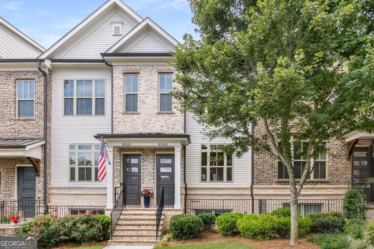 Welcome to 4312 Parkside Place, ideally located in the heart of the prestigious Townes at Chastain-a sought-after gated community just minutes from vibrant Chastain Park. This beautifully maintained townhome, built in 2018, offers an exceptional blend of modern luxury, thoughtful design, and low-maintenance living. Step inside to discover a bright, open-concept main level featuring 10-foot ceilings, expansive windows, and abundant natural light. The spacious living area is anchored by a gas fireplace, creating a warm, inviting atmosphere ideal for both relaxing and entertaining. The gourmet kitchen is a chef's dream, complete with Cambria Quartz countertops, Wellborn cabinetry, and top-of-the-line stainless steel appliances-perfectly combining elegance and function. Just off the living room, step onto a private deck, thoughtfully offering a peaceful outdoor escape ideal for morning coffee or enjoying a rainy day. Upstairs, you'll find two spacious bedrooms with en suite bathrooms, including a luxurious primary suite that opens to a second private deck -a perfect place to unwind in privacy. Both bedrooms feature custom walk-in closets, maximizing storage without sacrificing style. The lower level offers a flexible den or home office, ideal for remote work, a media room, or a quiet retreat-providing valuable extra living space to suit your lifestyle. With 1,801 square feet of well-appointed interiors, this home also includes freshly stained exterior decks, gas heating, and a central HVAC system for year-round comfort. Residents of Townes at Chastain enjoy access to outstanding amenities, including a community swimming pool and BBQ area, all within a secure, beautifully landscaped setting. Embrace the lifestyle you deserve at 4312 Parkside Place, where comfort meets sophistication.
