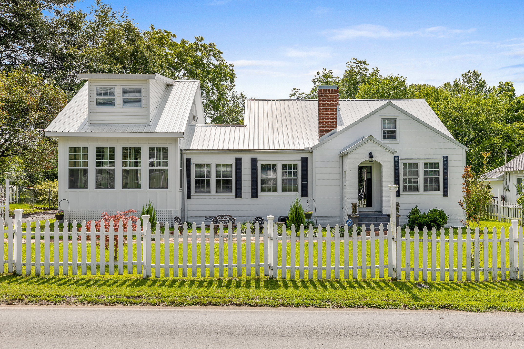 Welcome to old Southern charm. Renovated 12 room house, which includes 4 bedrooms with large bonus room as a possible 5th bedroom. Three bedrooms on main floor, one bedroom upstairs with a large bonus room as a potential 5th bedroom. Home features great room, library, living room, dining room, open concept kitchen, pantry/laundry room, two bathrooms, basement and stand-alone garage. Home has metal roof and hardwood floors throughout most of the home. The home has been updated with new wiring, new plumbing, new roof, new flooring, new bathrooms, new lighting, new garage doors, new windows, new fans, new fridge, and new fence. Property features a home warranty in addition to a screened-in patio, private sundeck and additional back deck. Back yard is fenced in and includes a custom-built doghouse on the backside of the garage with electricity, glass window and doors. Front yard is also fenced and landscaped. The house has a lot of natural light throughout. Home includes a security system with security lights. Home features 16 ceilings fans and central HVAC. Kitchen and bathrooms have natural stone surfaces. Quiet location within walking distance of stores, gym and downtown locations. All information provided by the seller.