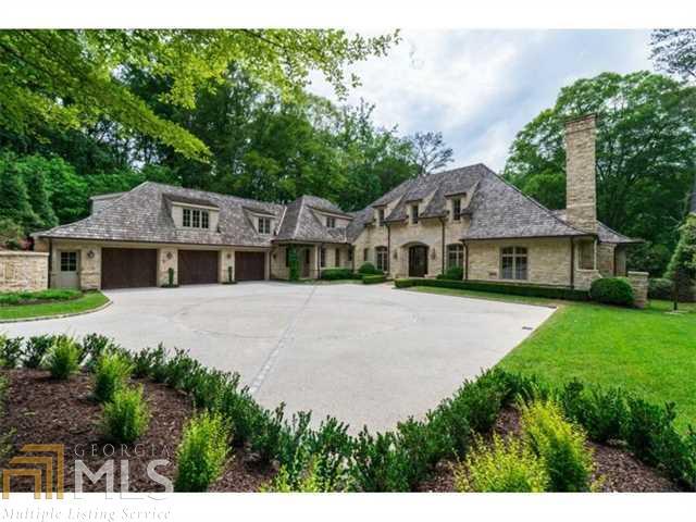 Oh the charm!! This gorgeous European style home is filled with too many custom details to list. Beautifully sited on a private wooded lot, this gated estate is as special on the back as the front with its covered outdoor porch overlooking the beautiful infinity edge pool. The light filled kitchen opens to a breakfast room and keeping room. Large master suite on main with vaulted beamed ceiling and huge closets. Gracious formal rooms, cozy library, full finished terrace level, 2 laundry rooms, high ceilings, stone floors, specialty woodwork throughout.