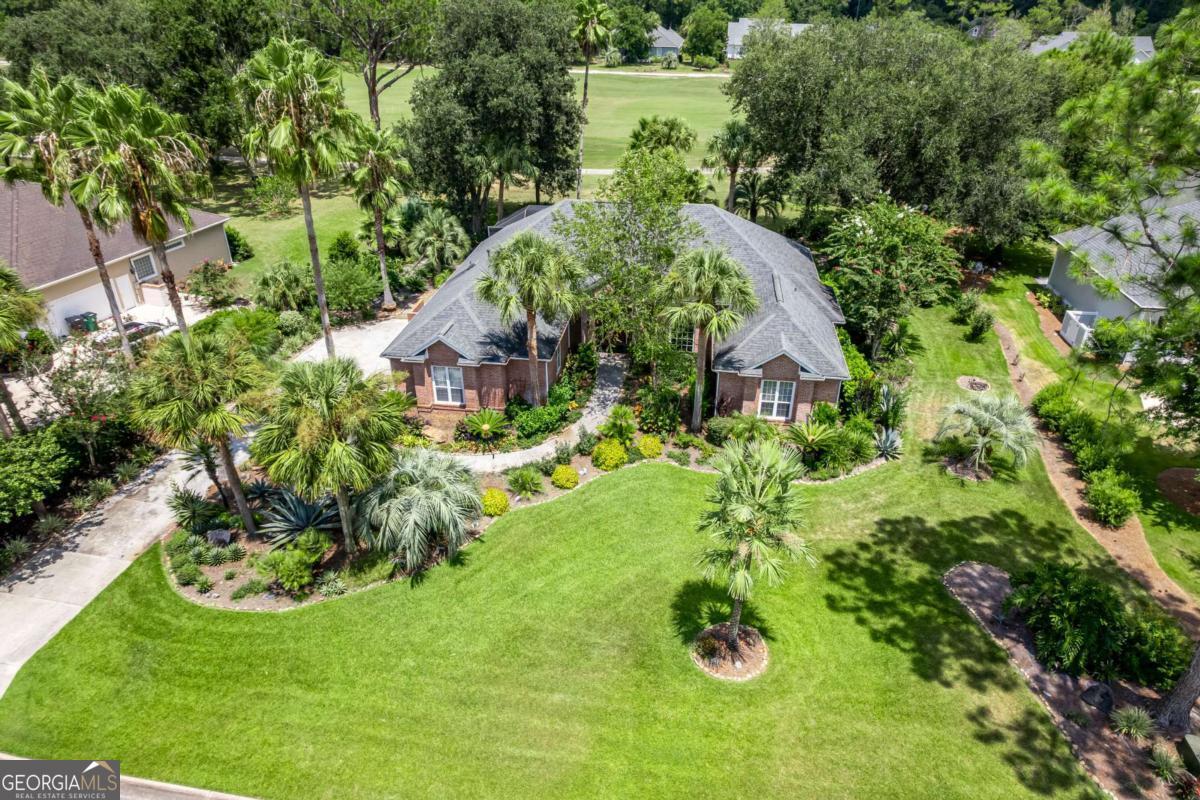 Welcome to your dream home nestled within the golf and waterfront community of Osprey Cove. This stunning brick residence offers the perfect blend of elegance, comfort, and luxury. Step inside to discover rich Brazilian Cherry flooring that seamlessly flows throughout the spacious interior. The gourmet kitchen is a cook's delight, featuring Jenn-Air appliances including a 6-burner natural gas cooktop. Relax and unwind in the inviting living room, enhanced by a beautiful gas fireplace that adds warmth and charm. The primary bedroom is a true sanctuary, complete with two generous walk-in closets offering ample storage space. The beautifully renovated bathrooms, the primary bathroom boasts a luxurious soaking tub, a walk-in shower, and anti-fog vanity mirrors-creating a spa-like retreat just for you. Enjoy outdoor living at its finest with a well-manicured lawn and meticulously landscaped yard. The homeowner was an avid gardener and landscaper, ensuring the yard is a lush, picturesque oasis. The screened porch and expansive screened entertaining patio provide the perfect setting for outdoor gatherings or quiet evenings overlooking the 6th fairway of the golf course. Osprey Cove is a premier golf waterfront community with an optional membership opportunity to enjoy a nationally ranked 18-hole golf course, clubhouse with golf shop, bar and restaurant. The River Club offers a junior Olympic-size swimming pool, Har-Tru tennis courts, a boat ramp and dock, a fitness center, and inviting on-site restaurants. The community provides an exceptional lifestyle for outdoor enthusiasts and those seeking resort-style amenities. Plus, residents enjoy a short boat ride to the scenic Cumberland Island National Seashore and Amelia Island, offering beautiful waterfront adventures just minutes from home. Convenience is key-Jacksonville International Airport is just about a 25-minute drive to baggage claim. The renowned Mayo Clinic is approximately a 47-minute drive, offering world-class healthcare close to home. For sports enthusiasts, shopping, and cultural events, vibrant entertainment options are just 35 minutes away, ensuring you're never far from the action. This exceptional home combines sophisticated amenities with a prime location in a vibrant, amenity-rich community. Don't miss the opportunity to live in this picturesque neighborhood-schedule your private tour today!