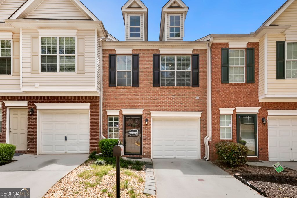 Well-maintained townhome in desirable Avondale Estates featuring a bright kitchen with breakfast bar island, open dining area, and fireside living room. Upstairs offers two spacious bedrooms-each with a private full bath-including a primary suite with vaulted ceilings, double vanities, and a walk-in closet. Enjoy a fenced backyard with a patio, perfect for relaxing or entertaining. Conveniently located near dining, shopping, parks, and major highways.