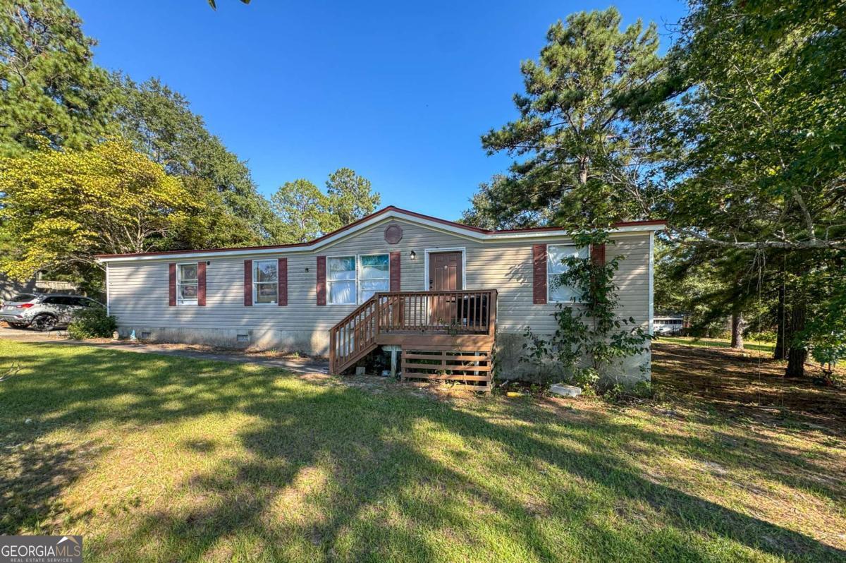 Welcome to Jones County! This 3-bedroom, 2-bath mobile home offers an opportunity in a convenient location. Situated between Macon and Milledgeville, and just a short walk to Mattie Wells Elementary, the spot couldn't be better. The home itself is a fixer-upper with great potential-perfect for someone looking to put their own touch on a property. Whether you're ready to roll up your sleeves and create your dream home, or searching for an affordable investment opportunity, this one is ready to be yours.