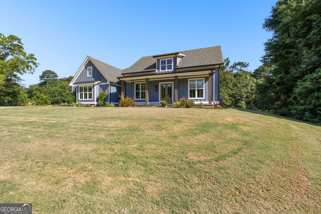 Photo of 1005 Goza Rd, Fayetteville, GA 30215 (MLS # 10842756)