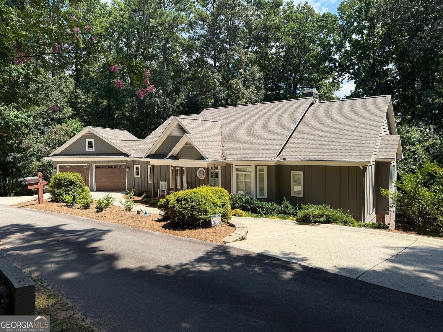 Listed below the current appraisal, this isn't just another house on Lake Lanier, it's a place to create a lifestyle. Tucked away on a private road reserved only for homeowners, this well-maintained craftsman home was built for lake life from the ground up. The level, grassy lot stretches right to the water's edge where a single-slip, deep-water dock sits on a solid rip-rap shoreline. It's the perfect setup for mornings with coffee on the porch, afternoons tubing or fishing, and evenings around the firepit with family and friends. Inside, the main level is designed for comfort and gathering: an open vaulted great room, a study, wet bar, owner's suite, and a guest bedroom. Downstairs, the finished terrace level adds even more space with a second wet bar, family room, sauna, and two additional guest bedrooms-ideal for hosting. Additional highlights: * Three-car garage with room for vehicles, golf cart, and lake gear * Layout that works for both everyday living and weekend entertaining * Year-round lake views in a sought-after South Lake location * Easy access to I-985 and Atlanta, while minutes from the charm of Flowery Branch and Buford This isn't about granite counters or square footage-it's about family. It's about a dock full of life jackets, a cooler full of drinks, and memories that last a lifetime. A solid, cared-for lake home that's ready for its next chapter.