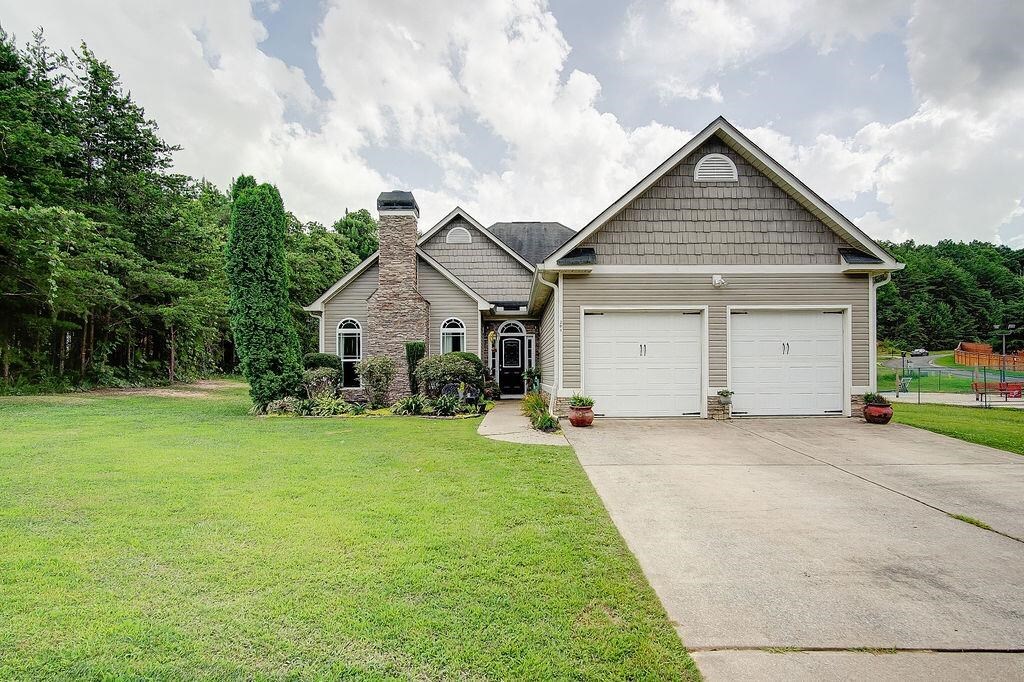 THIS is the Ranch home you've been waiting for! This lovely home sits on a large, level lot with a tremendous feeling of privacy even in such a great neighborhood! Enter the front door to a spacious foyer and formal living room with a lovely wood-burning rock fireplace. Separate dining room and kitchen with oak cabinets opens to a family room with vaulted ceiling and French door to patio. Two good-sized secondary bedrooms and an updated second bathroom lead to a large master suite and master bath with separate tub and shower. Two car garage. Shed and lean-to remain. Dogs in back yard are staked and friendly, but prefer not to be disturbed. As always, use caution.