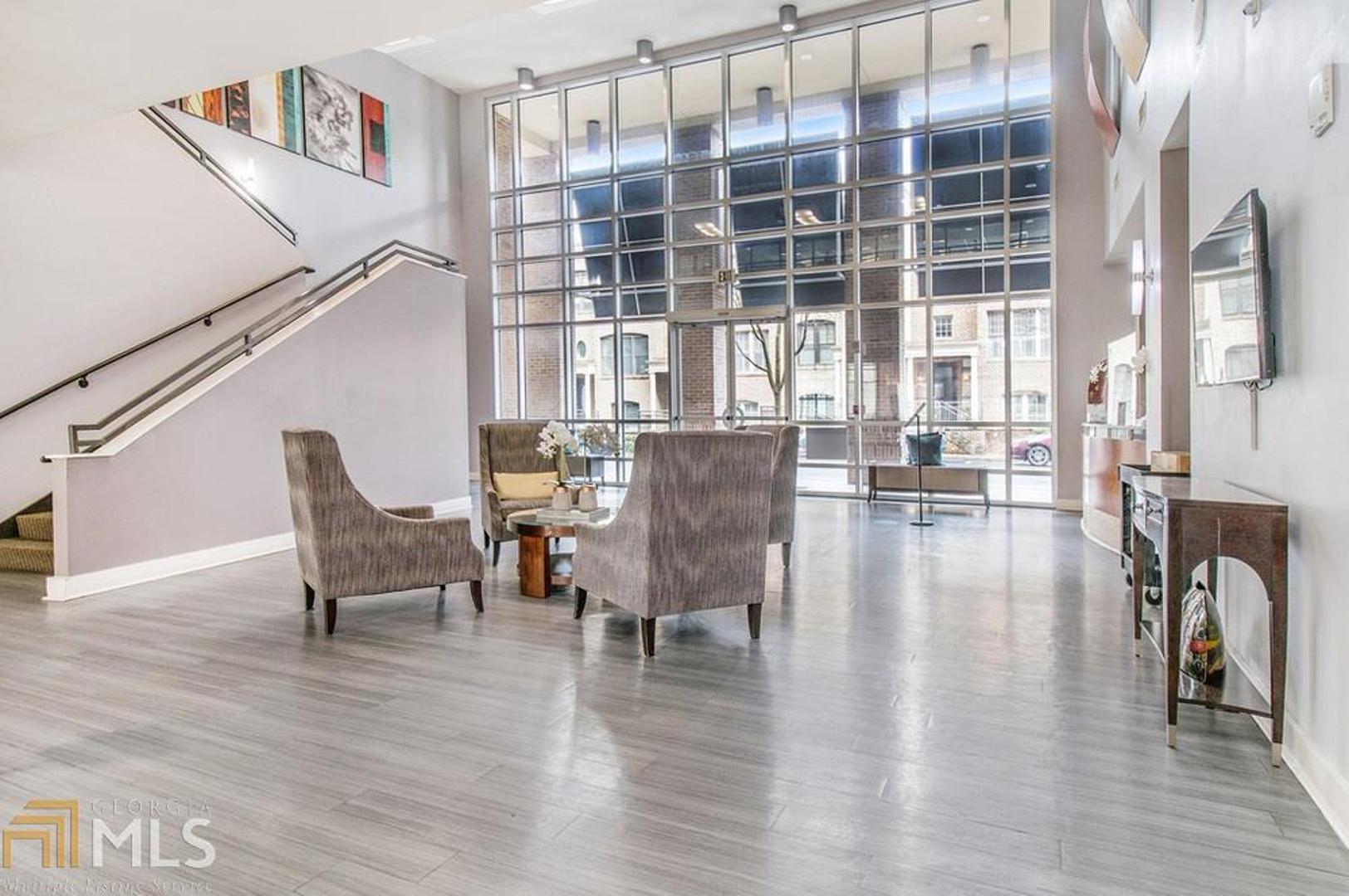 Do you want to live in the Heart of Buckhead? Great location for this 2 Bedroom Condo in the gated Cosmopolitan. Enjoy the views, the natural daylight, and the Open Floor Plan this Upgraded 10 feet ceiling condo has to offer! Beautiful Hardwood flooring, Large Kitchen Island with Granite Counters and Stainless Steel appliances, overlook the family room, and the dining room. Master Bedroom with Custom Closet and a spacious Master Bath with double vanity. 2 car parking. Cosmopolitan amenities include: 24 hour Concierge, Swimming pool, Conference room, Exercise room, Club Room, Billiard Room, Theater Room. Close to Marta, Shopping, Restaurants.