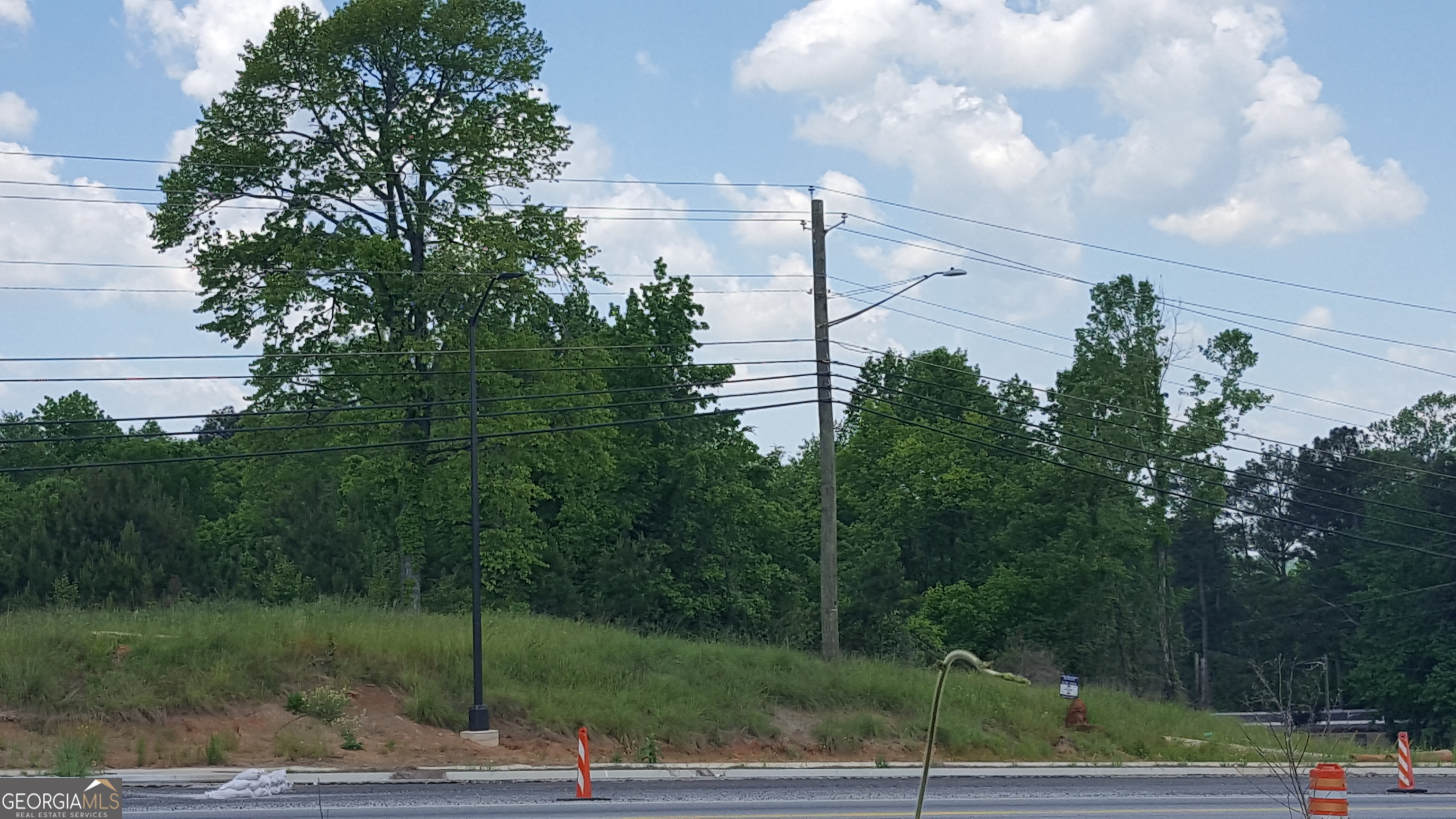 Prime commercial property located at a signalized intersection on Georgia Hwy 92 in the city limits of Douglasville Georgia. High Traffic counts in an area primed for development. All public utilities are available. perfect location for retail development, restaurant or other commercial structure. property is currently zoned General Commercial.