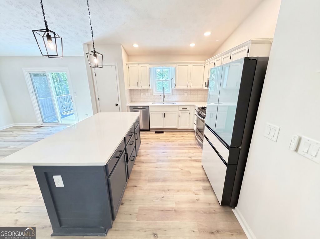 Photo of 1327 Towne Harbor Trail, Woodstock, GA 30189 (MLS # 10737309)