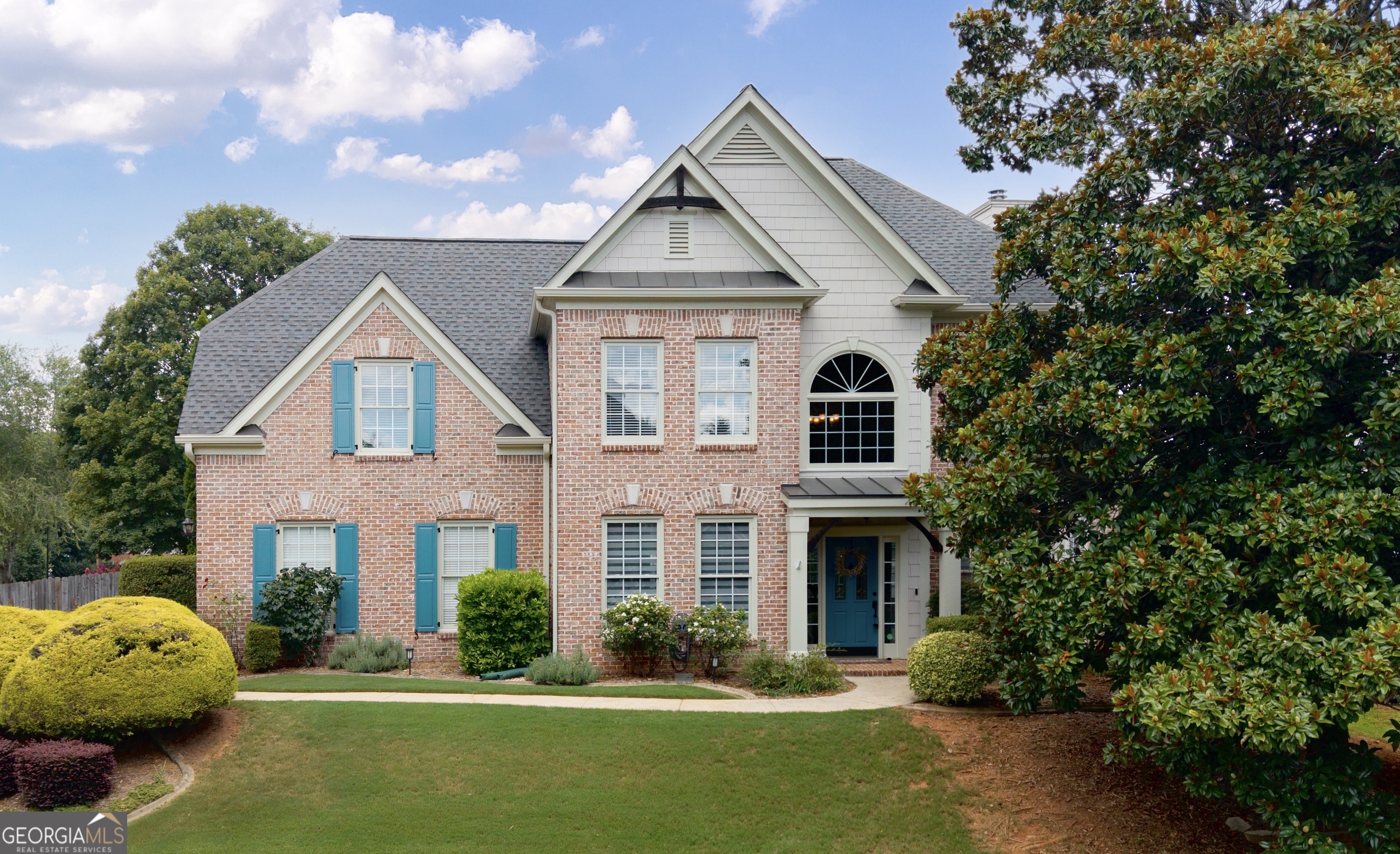 Welcome to 1085 Arbor Creek Drive - where location, lifestyle, and comfort converge in one of Roswell's most connected and coveted corners. Perfectly positioned between Downtown Roswell, Alpharetta, Avalon, and Milton, this home offers easy access to GA 400, top-rated Milton schools, and beloved local spots. Hembree Park is just a short stroll away, offering tennis courts, playgrounds, walking trails, and open green space. Enjoy a weekend concert at Ameris Bank Amphitheatre, grab dinner at one of the area's award-winning restaurants, or run everyday errands in minutes. Inside, you'll find a classic yet versatile layout featuring hardwood floors throughout the main level, a formal dining room adorned with chair-rail molding, and a separate living room plus fireside family room - perfect for both entertaining and unwinding. The kitchen offers stone countertops, stainless steel appliances, a breakfast bar, and an eat-in breakfast nook, flowing seamlessly into the heart of the home. Upstairs, the spacious primary suite boasts tray ceilings, a walk-in closet, and a private bath with double vanities and a jetted tub, while three additional bedrooms offer plenty of room to spread out. A fenced, level backyard, complete with a patio and enclosed sunroom, provides a private outdoor escape. Nestled on a corner lot, this Arbor Creek home delivers a rare combination of comfort and convenience, ready to welcome you home.