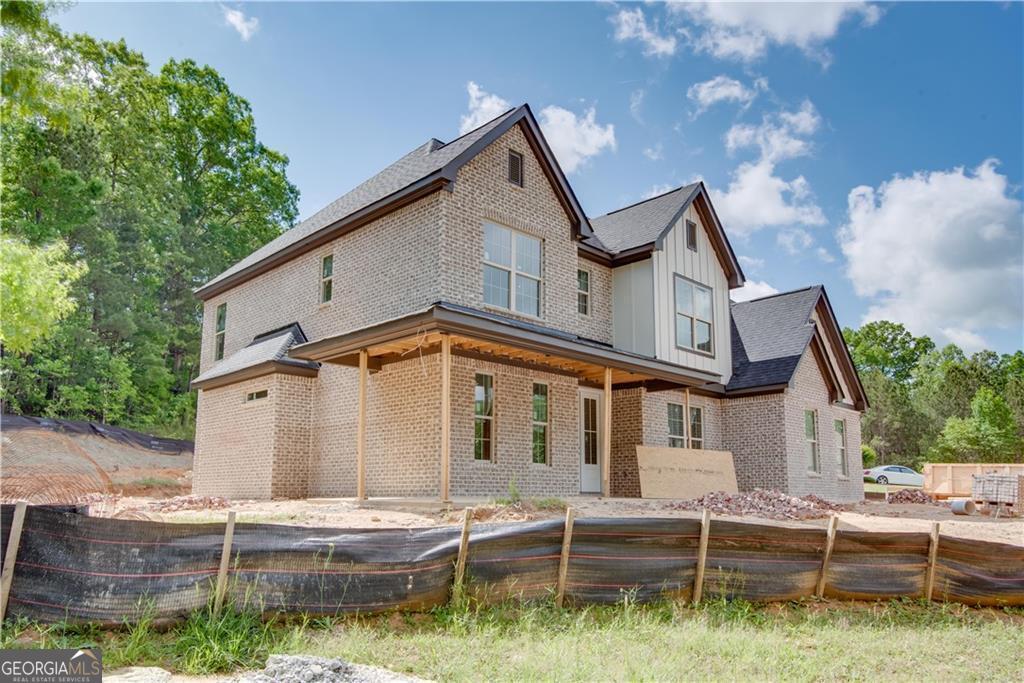 A beautiful new construction located in the community of Le Jardin. This large home features a large open floor plan. Living room and dining room with coffered ceilings, family room with fireplace and additional keeping room off kitchen. Beautiful kitchen with 42 inch cabinets with plenty of storage, gas cooktop, wall oven/microwave, separate pantry, large island and separate breakfast area. 5" real oak hardwood throughout main level. Bedroom and full bath on main level. Upstairs owners bedroom with sitting lounge and two closets one with direct access to the laundry room. Spa like owners bath with soaking tub and spa style shower. Large secondary bedrooms with shared Jack n Jill bath. and fifth bedroom with a private bath. Incredible wrap around front porch. Large back covered patio overlooking the lovely backyard. Three car garage.