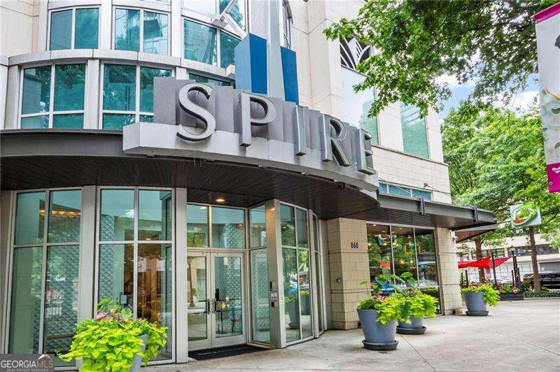 Exciting Updated Move In Condition with a Large 7th Floor Balcony - New Cosmetics, New HVAC, New Oven range, New Vent hood, and Polished Hardwood Type Floors, . . . Experience modern luxury on the 7th floor of the SPIRE Condominiums, FHA approved! Very exciting cosmetically updated 1-bedroom, 1-bath garden home. The balcony is freshly landscaped and spacious for large gatherings, entertaining, or just relaxing with a book. Enjoy abundant natural light in an open-concept layout that emphasizes convenience and efficiency with 10' ceilings throughout. An open gracious foyer kitchen area greets your guests. The open and tall main living room flows seamlessly from the modern kitchen to the open balcony with large planters. The spacious updated primary bedroom includes good closet space, while a spacious primary bathroom is equipped with a shower/tub and a large granite countertop vanity. A dedicated stack-able laundry area adds to the practicality of this garden style home. Ideal desk niche to organize and plan. Don't sweat it as shared, all new HVAC installed Too! Floor-to-ceiling windows offers generous daylight and the private balcony is the perfect spot to unwind while entertaining for hours. Residents enjoy premier amenities, including 24-hour concierge service, a gated entrance, rooftop pool, business center, key fob access, assigned covered parking, fitness center, game room, lounge area, dog park, and club room. Rental restrictions do apply, so please See HOA Management. Ideally located in Midtown with easy access to nearby downtown, restaurants, shopping, numerous services, education and I-75/I-85. Don't miss your chance to embrace modern luxury living in the heart of the city! A home that has it all, ideal for Fannie Mae Homepath Ready Buyer Program. See private remarks. Agents if Showing - Call the Concierge's Desk Before Going 404-961-7950 - Once on Site Go To Concierge's Desk When You Arrive to Receive Parking Pass To Park, Then Back to Concierge To Receive Access to Elevators and SUPRA Box. Very Exciting Home, Inspect, Compare and Price. Awaits Your Inspection! See Below To Show and How To Make an Offer.