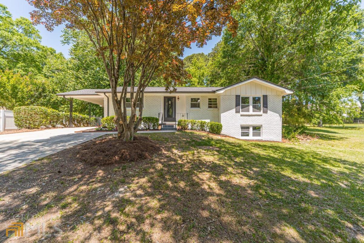 Welcome to this newly renovated home. 4-sided brick ranch style!!! Check this property inside and out! Lots of upgrades!!! 3 bed/ 2 bath, screened porch, finished basement- immaculate condition. Extra-large laundry room next to the kitchen, New appliances, New Paint, New Flooring, New HVAC, New Roof, New Windows, New Water Heater, all smooth ceilings throughout, new light fixtures and doorknobs, totally renovated bathrooms, new shower doors, brand new kitchen & appliances, Granite Counter tops, and backsplash. Seller removed old trees in the front and backyard. 2-car carport. This peaceful East Cobb neighborhood! Won't last! NO HOA, ON SEWER. Easy access to I-75, 3 mi from Marietta Square.
