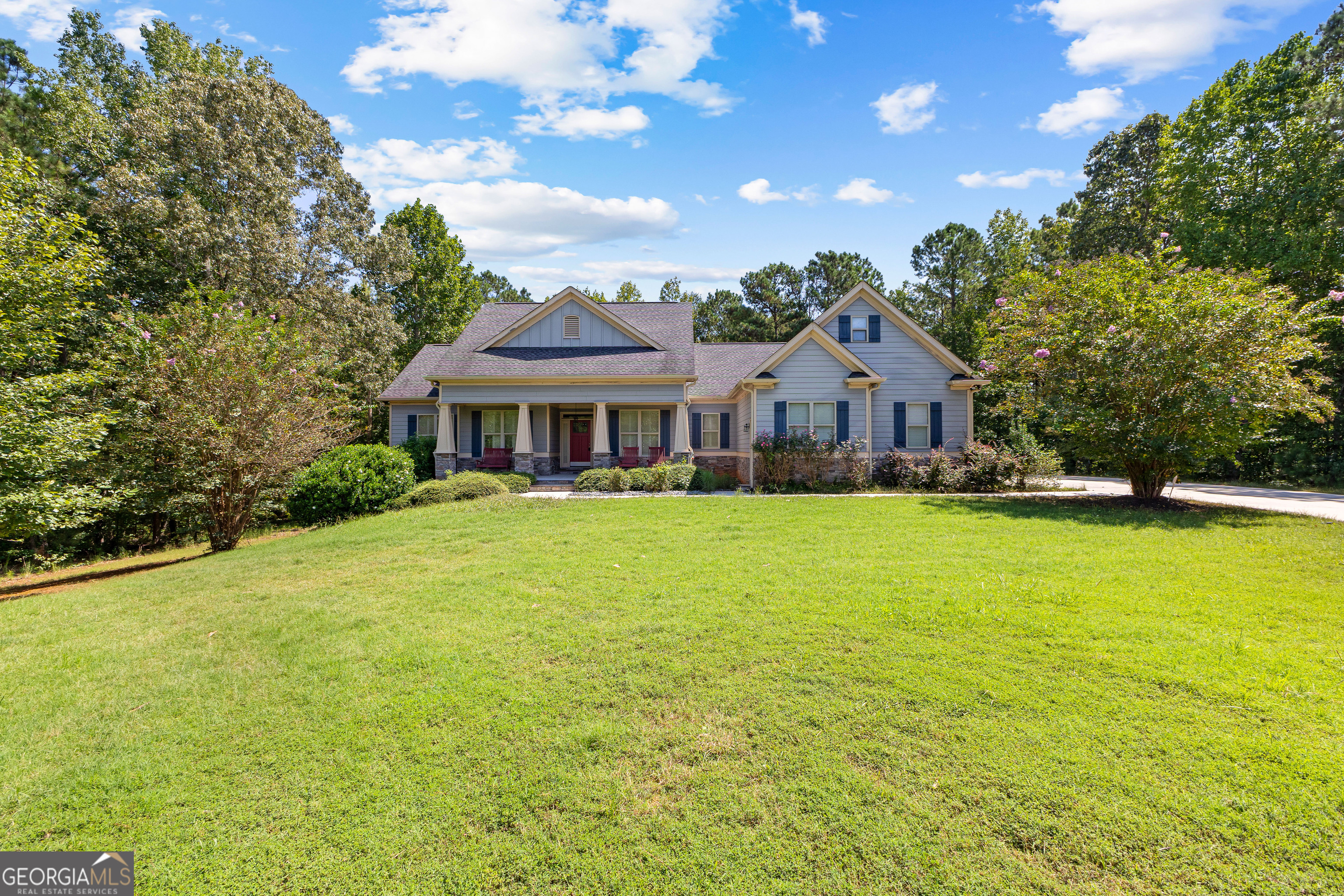 Looking for single-level living with the flexibility of a full basement? Welcome home to 256 Jasper Drive, a beautifully designed 3-bedroom, 4-bath ranch tucked away on a private cul-de-sac lot surrounded by woods. This home offers thoughtful upgrades and the potential to expand with future finished space in both the walk-up attic and basement. Step inside to a welcoming foyer flanked by a versatile office/library and a formal dining room. The open-concept design seamlessly connects the great room-with a cozy gas-log fireplace-to the chef's kitchen and breakfast area, creating the perfect layout for both everyday living and entertaining. The kitchen is a dream for any cook, featuring custom cabinetry, a stainless steel farmhouse sink, gas chef's range with pot filler, secondary wall oven, and a walk-in pantry with custom shelving. The spacious primary suite boasts a custom closet system and a spa-like bath with a large tiled shower (dual showerheads), clawfoot soaking tub, and custom cabinetry. Two additional bedrooms each enjoy their own en suite bathrooms with granite counters, tiled tub/shower combinations, and upgraded finishes. Storage is abundant, with an unfinished basement and walk-up attic offering plenty of room. The basement already includes a finished full bath, making it well on its way to becoming your dream recreation space, media room, or guest suite. Outdoor living is just as inviting with a covered rear porch, separate grilling porch, and a 3-car garage that completes this picture-perfect ranch.