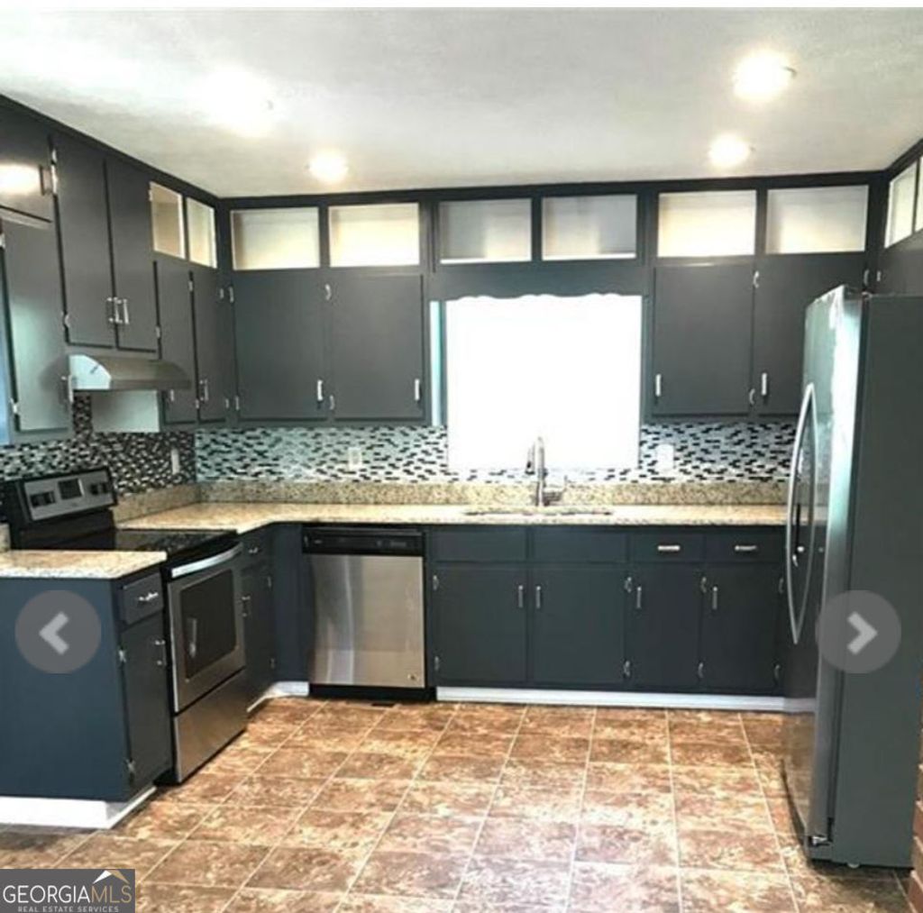 Photo of 6744 Rockbridge Road, Stone Mountain, GA 30087 (MLS # 10631286)