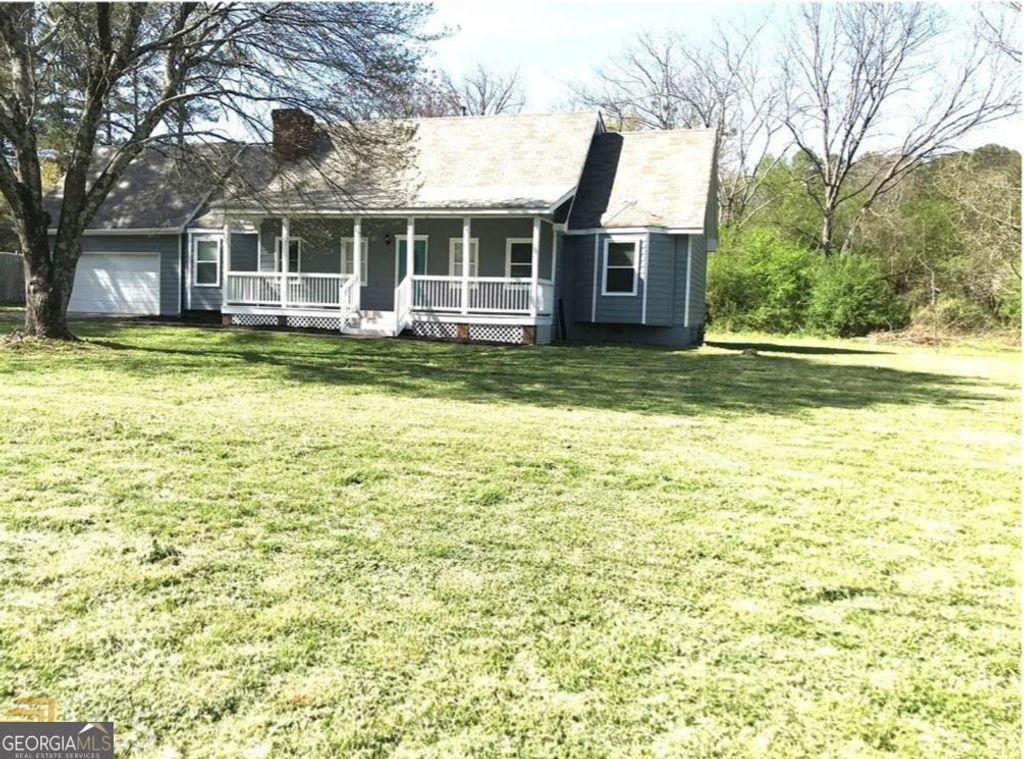 Photo of 6744 Rockbridge Road, Stone Mountain, GA 30087 (MLS # 10631286)
