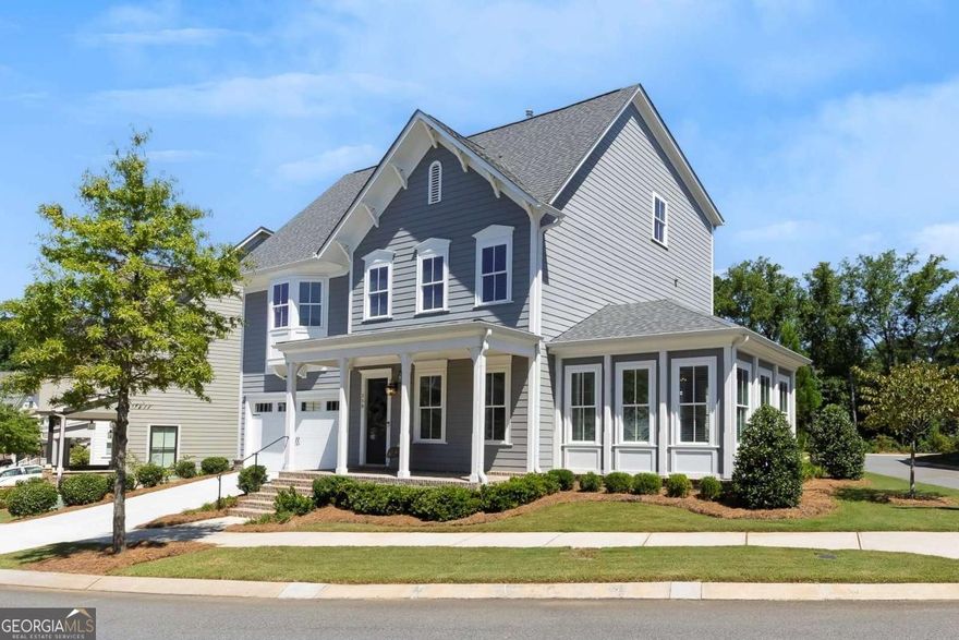 This is the home and lifestyle you've been dreaming of. Perfectly situated on a coveted corner lot, this single-family residence offers one of the largest backyards in South on Main, right in the heart of Woodstock. The location is unbeatable-just steps from shops, restaurants, concerts at the Amphitheater at City Center, world-class productions at Woodstock Arts, the Greenprints Trail system, the downtown farmers market, and so much more. Designed with both comfort and style in mind, the open-concept main level is filled with natural light and features a welcoming family room with fireplace, a spacious dining area, and a chef-inspired kitchen complete with abundant cabinetry, quartz countertops, a center island with seating, top-of-the-line stainless steel appliances, and a large pantry. From here, enjoy direct access to the covered rear patio, perfect for grilling or relaxing while overlooking the beautifully landscaped, fenced backyard-a rare find in this community. A vaulted sunroom offers a flexible space for lounging or a home office, while a convenient guest bedroom and full bath complete the main floor. Additional thoughtful details include a drop zone off the two-car garage for everyday ease. Upstairs, the generous owner's retreat is a true sanctuary with a spa-like bath featuring double vanities, a soaking tub, a glass-enclosed walk-in shower, and a large walk-in closet. Two additional bedrooms share a connecting bath, and a well-equipped laundry room with sink and storage adds convenience. The third level offers even more flexibility with a bonus room ideal for game day or movie nights, plus an additional bedroom and full bathroom. Life at South on Main is second to none. This premier community features 20 acres of green space and parks, a community garden, firepit, resort-style swimming pool with splash pad and cabana, and a 6,000-square-foot clubhouse with fitness center, game room, and conference space. Residents also enjoy two dog parks, a play park, an open-air pavilion, "The SHED" stage for events, and direct access to the Noonday Creek Trail, part of the expansive Greenprints system. All of this is just moments from the vibrant energy of Downtown Woodstock and minutes from I-575 for an easy commute to Atlanta and beyond. Discover why South on Main and Woodstock remain among North Georgia's most sought-after destinations-this home truly offers it all.