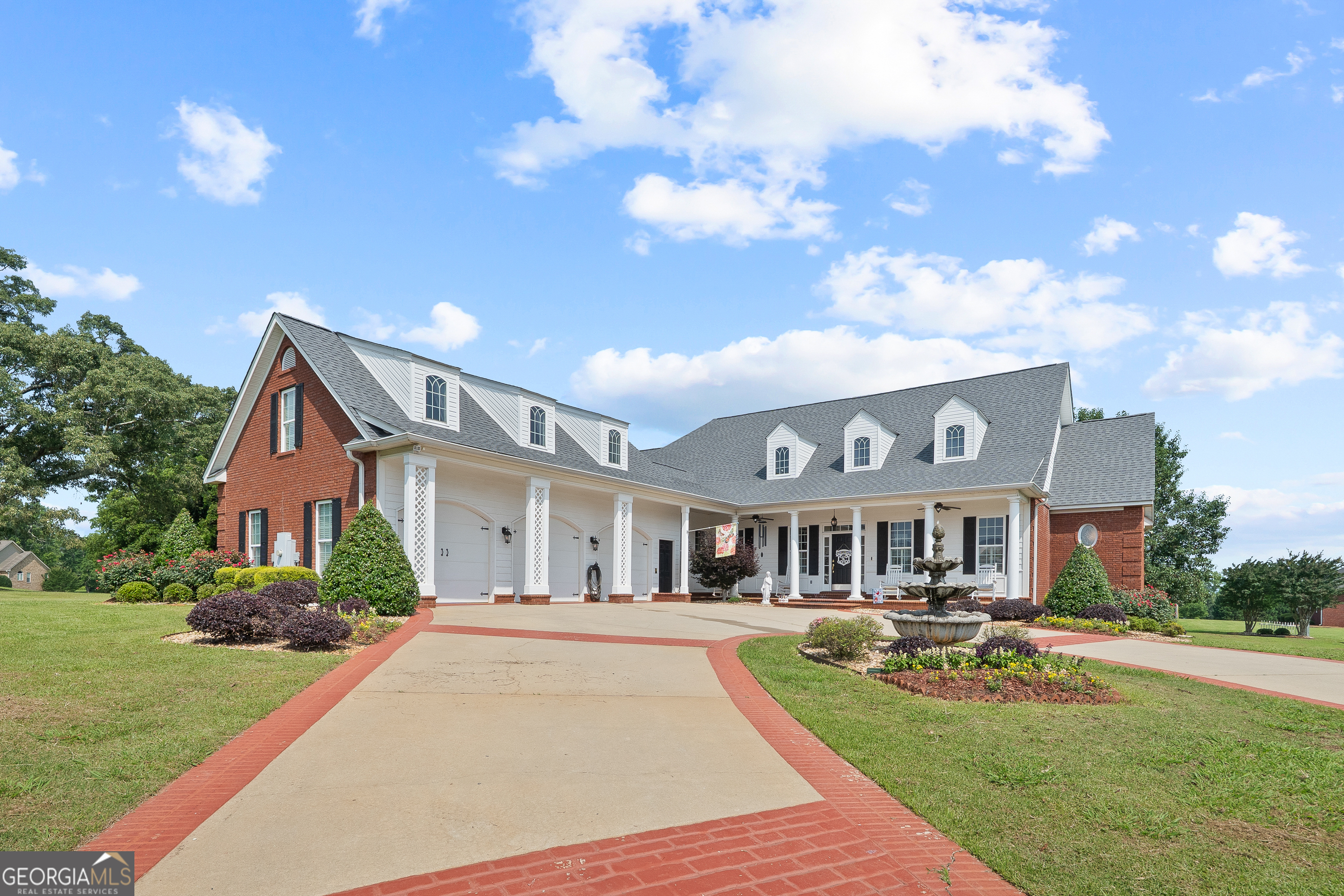 Beautifully designed 4,773 sq ft custom home on a serene 1.2-acre lot with lake access in Browns Cove, this spacious retreat offers a perfect blend of elegance, comfort, and functionality with views of Lake Tobesofkee. Featuring 5 bedrooms and 5 full bathrooms, this home was thoughtfully designed for both family living and entertaining. The large open floor plan is accentuated by beautiful crown molding, high ceilings, and rich natural light throughout. At the heart of the home is a gourmet eat-in kitchen complete with a cozy sitting area and fireplace, upscale stainless steel appliances, a wet bar, and ample prep and storage space plus an oversized island - perfect for hosting gatherings or enjoying quiet mornings. The master suite provides a private retreat, complete with an ensuite bathroom, sitting area with fireplace for ultimate relaxation. Upstairs, a generous playroom provides flexible space for recreation or relaxation. Over the garage, you'll find a private theater room with its own mini bar and full bathroom, offering the ultimate entertainment experience. Schedule your private showing today and make this Browns Cove gem your forever home.