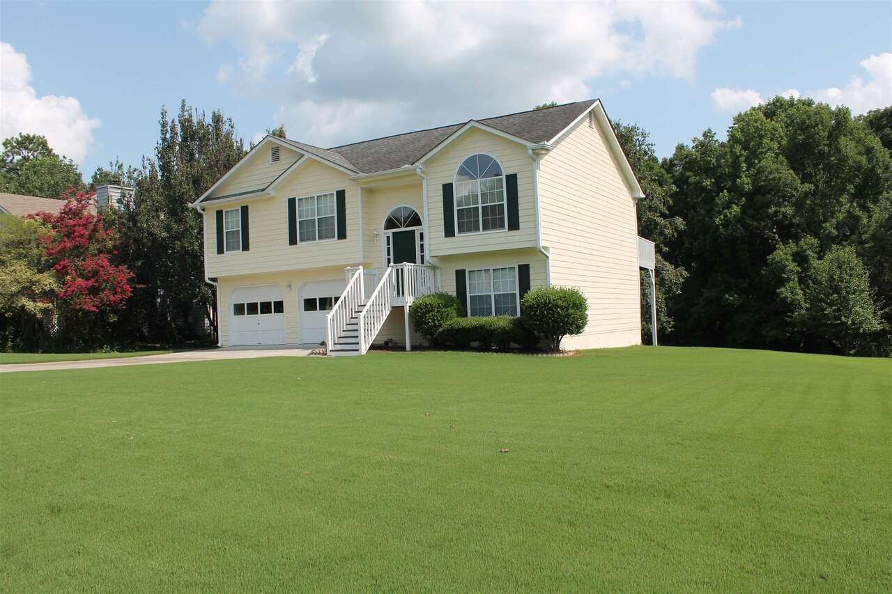 Amazing home, huge back yard, with a running creek. Large newly painted deck with bench seating to over look the manicured lawn and to listen to the running water from the creek. Large manicured front yard and front porch. Inside you will find a finished newly painted basement, with bedroom and finished full bath. A den and side room. Up stairs, large family room, kitchen with eat in area, and separate dining room. Master with walk in closet and double vanity bathroom, garden tub and separate shower. Two other bedrooms and a full guest bathroom, also newly painted. Large over sized 2 car garage with storage.