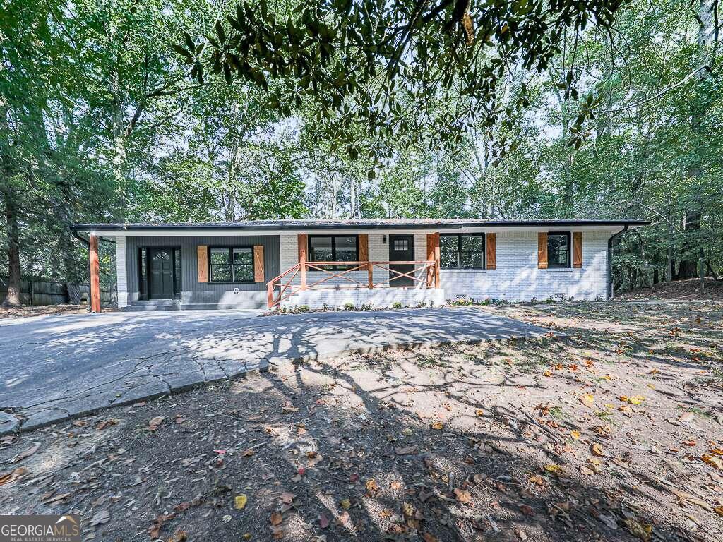 PRICE REDUCED! EVERYTHING IS NEW! NEW Architectural Shingle Roof w/Ridge Vents, NEW ALL ELECTRIC HVAC, NEW Electrical Panel, NEW Plumbing, NEW Insulated Windows and Doors, NEW Hot Water Tank, NEW Appliances, NEW Cabinets, NEW Flooring, NEW Insulation in walls and attic...the list goes on and on! Are you looking for a home that is located in a established neighborhood and convenient to everything? Look no further and fall in love with the touch-of-gold, modern design! The open concept living area is the heart of the home with recessed lighting, luxury vinyl plank flooring and open to a gorgeous kitchen! Light and bright kitchen cabinets, under cabinet lighting, designer back splash, all new appliances, counter seating at island and double sided storage area are just a few of the features of this new kitchen. The owners suite is over-sized with a walk-in closet and luxury spa-like bath. The bath has ample storage space in the double-vanity with touch-of-gold features on handles, lighting and mirrors and shower. A HUGE frameless shower with bench seating and double shower head completes the owners suite. On the opposite end of the home you'll find 3 secondary bedrooms and a spacious hall bath. In the hall bath is also where the laundry is located. A NEW sliding door leads to the covered rear porch and a chain link fence in the back yard make this home ready for pets and playtime! Be sure to click on the 3D tour to be able to zoom in on all of these beautiful touches and better understand the flow of the home. All available warranties will be transferred to the new owner at closing. Make your appointment today to view this beauty!