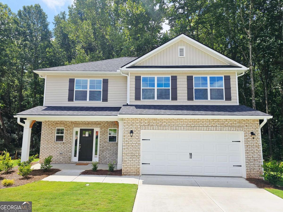 Welcome to "The Hearthwood Retreat" - A Spacious 2131sq ft 4BD/2.5BA Haven in Scarlett Place! cul-de-sac retreat! This two-story home features an open-concept living area, granite countertops with tile backsplash, main-level master suite with separate tub & shower, and a versatile upstairs rec room. Standard features include full sod front & back, 30-year shingles, brick-front exterior, 51/4 baseboards (even in the garage), tray ceiling in master, garbage disposal, and more. Covered patio perfect for relaxing outdoors. No HOA, USDA eligible, only $1,000 earnest money! **Price Reflects Builder Incentive**