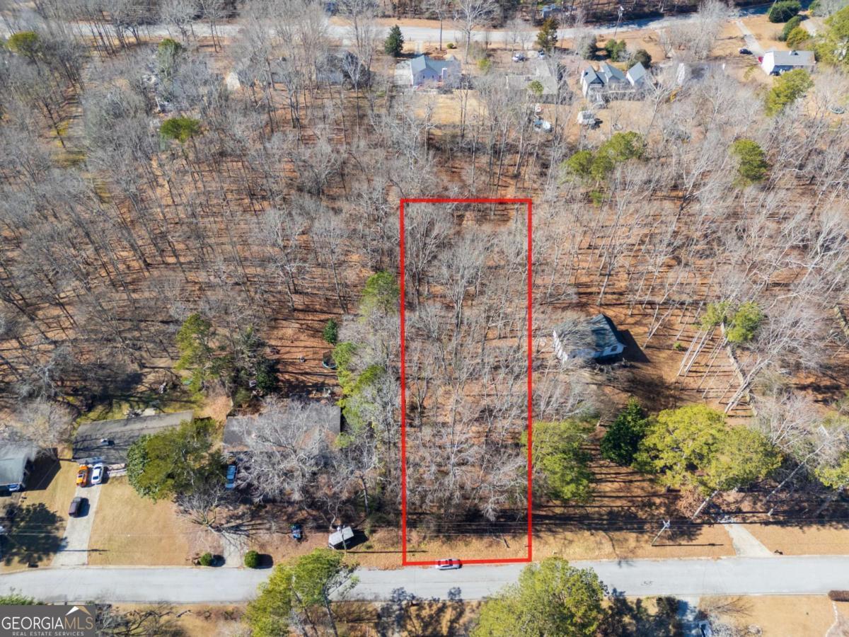 This .46-acre lot, located right off Bomar Rd in the heart of Douglasville, is a rare find! Nestled near the Publix shopping center, top-rated schools, and Tyler Perry's new Lions Gate Studios, it offers both convenience and promising investment potential. The lot includes a drainage easement, providing unique opportunities for future development. Priced to sell, the seller is open to all reasonable offers. Don't miss out on this incredible deal! For further details or to discuss your offer, contact Toni Uboh today.