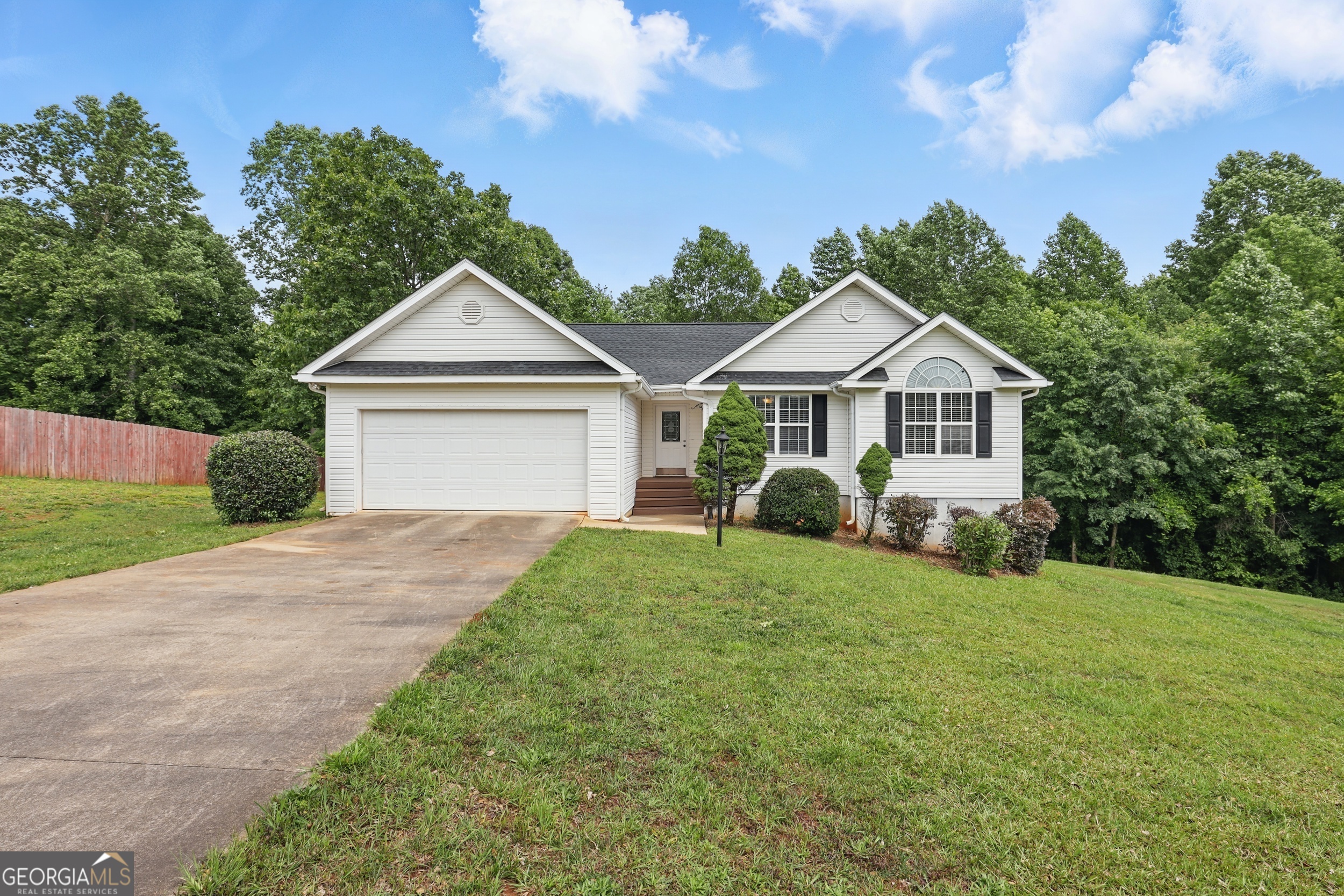 Welcome home to this charming 3-bedroom, 2-bath single level home with fireplace. Backing up to more than 3 acres of greenspace with a creek nestled into a peaceful cul-de-sac in the desirable Nickel Creek subdivision. Set on a level 0.74-acre lot, this property offers a well-designed living space with a large backyard perfect for privacy and enjoying the outdoors. All kitchen appliances are included. Enjoy the quiet of the neighborhood while being just 10-15 minutes from both Cornelia and Clarkesville, where you'll find all the shopping, dining, and everyday conveniences you need. Don't miss this opportunity for peaceful suburban living with close proximity to town!