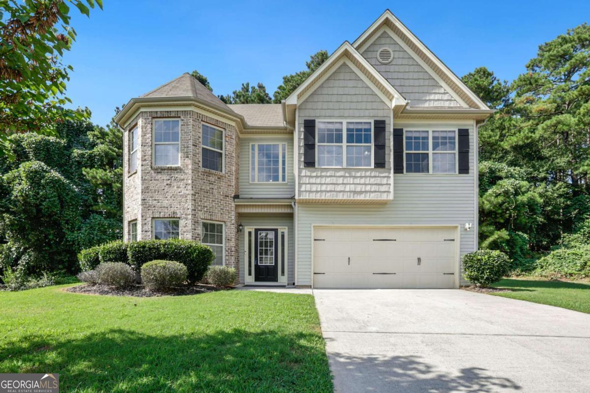 Welcome to this lovely, maintained home, ideally situated on a quiet cul-de-sac in the thriving Park Place community! Bright, open spaces and warm-toned flooring flow throughout the main level, creating an inviting atmosphere from the moment you step inside. The striking two-story foyer leads to a versatile flex room-perfect as a formal living room, dining area, or dedicated home office. The sunlit, open-concept living room features a cozy fireplace, making it an ideal space for gathering and relaxing. The adjacent modern kitchen is both stylish and functional, showcasing granite countertops, an island with room for seating, a spacious pantry, and a bright breakfast nook with tranquil views of the tree-lined backyard. Upstairs, escape to the oversized primary suite, complete with a double tray ceiling and ample space for a cozy sitting area. The en-suite bath offers dual vanities, a soaking tub, a separate glass-enclosed shower, and a generous walk-in closet. Three additional spacious bedrooms and a full hall bath provide room for everyone, while the upstairs laundry room adds everyday convenience. Step outside to a large patio slab-perfect for outdoor entertaining, grilling, or simply unwinding-backed by the serenity and privacy of mature trees. Enjoy community amenities such as a swimming pool, playground, and park, all while being conveniently located near top-rated schools, shopping, dining, and major commuter routes. Don't miss your opportunity to own this delightful home-schedule your private tour today!