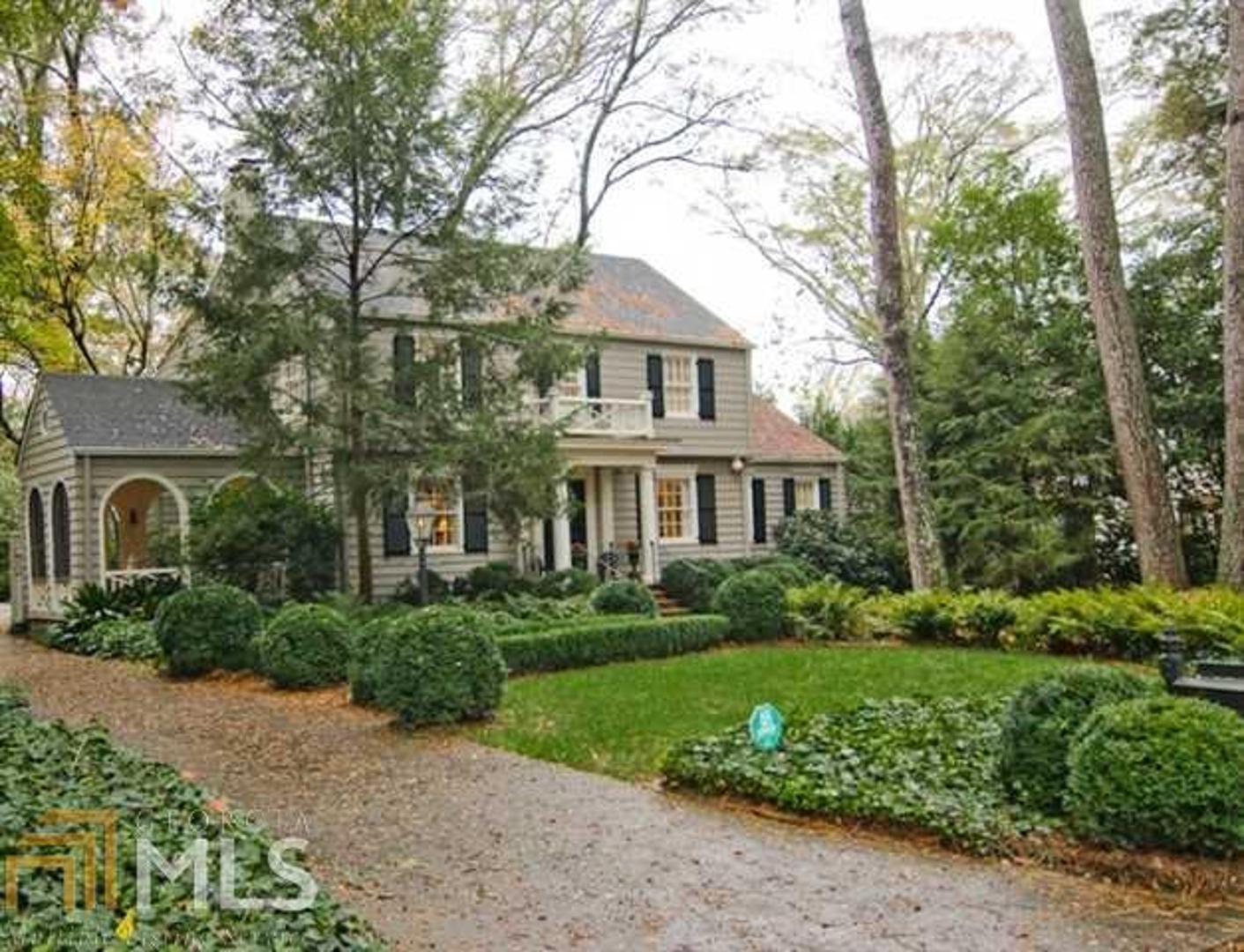 Beautifully maintained charming Haynes Manor Family Home. Living Room with Fireplace, glassed in sun porch, separate Dining Room. Library and separate Bar designed by Spitzmiller and Norris in 2005, Quality built arched cabinets, built in desk. Large Family room with wood burning fireplace, French doors opening to deck overlooking large flat fenced in back yard. Updated kitchen with top of the line appliances, built in cabinet for storage and desk. 3 bedrooms upstairs, spacious master with large bathroom and large walk in closet. 2 other bedrooms have private baths.