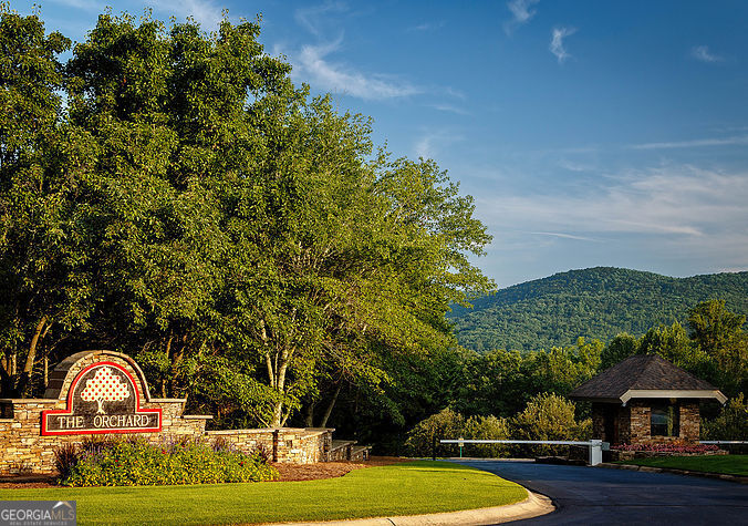 Welcome to 300 Orchard Drive Clarkesville, Habersham County! Build your dream home in The Orchard Golf & Country Club, a premier gated community in Georgia's wine country. This .85-acre lot situated between the #15 and #16 fairways. The Orchard Golf offers lakefront serenity, mountain views, and proximity to the Chattahoochee National Forest, waterfalls, and Clarkesville's charm. Residents enjoy a championship 18-hole golf course, clubhouse, pool, fitness center, tennis, pickleball, and a vibrant neighborhood atmosphere. With its blend of luxury, privacy, natural beauty, and convenience, The Orchard is the perfect setting for a full-time residence, vacation retreat, or custom lakefront escape.