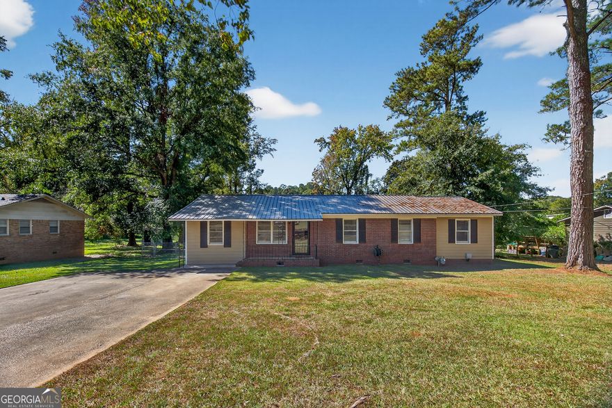 Absolutely Adorable "Dollhouse" Charmer! This picture-perfect 3-bedroom, 2-bath home is full of personality and thoughtful updates! Step inside to find a flowing, open floorplan featuring an oversized family room and updated life-proof LVP flooring throughout. The beautifully renovated bath showcases a custom tile shower with a frameless glass door for a touch of luxury. The spacious primary suite includes a private office or sitting area-ideal for relaxing or working from home. Entertain in style on the amazing covered game day back deck overlooking the private, level backyard. Impeccably maintained and move-in ready-this one is an absolute must-see!