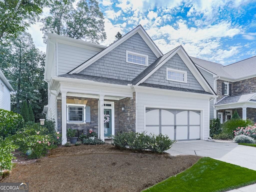 Beautifully maintained and move-in ready, this 3-bedroom, 2.5-bath home offers timeless charm and modern updates on a manicured, level lot in a sought-after community where the HOA maintains the yard for easy living. The main level features a spacious primary suite with a soaking tub, double vanity, and walk-in shower. The updated kitchen boasts brand-new quartz countertops, a stylish backsplash, new microwave, and gas cooktop. A large dining room and inviting family room showcase stunning built-in bookcases and a cozy gas log fireplace, while gleaming hardwood floors grace the main level and staircase. Upstairs, you'll find two additional bedrooms connected by a Jack & Jill bath, plus a huge enclosed loft-perfect for a home office, media room, or guest space. Brand-new designer carpet adds warmth and style to the upstairs living areas. Ample storage is a highlight, including a walk-in attic. The entire interior has been freshly painted in designer colors, creating a warm and welcoming feel. This home has one of the most private back yards in the community so relax and unwind on the screened porch, ideal for enjoying a peaceful evening. Centrally located between Woodstock and Roswell, this home offers convenience, comfort, and style-all in one. This is not an active adult community.