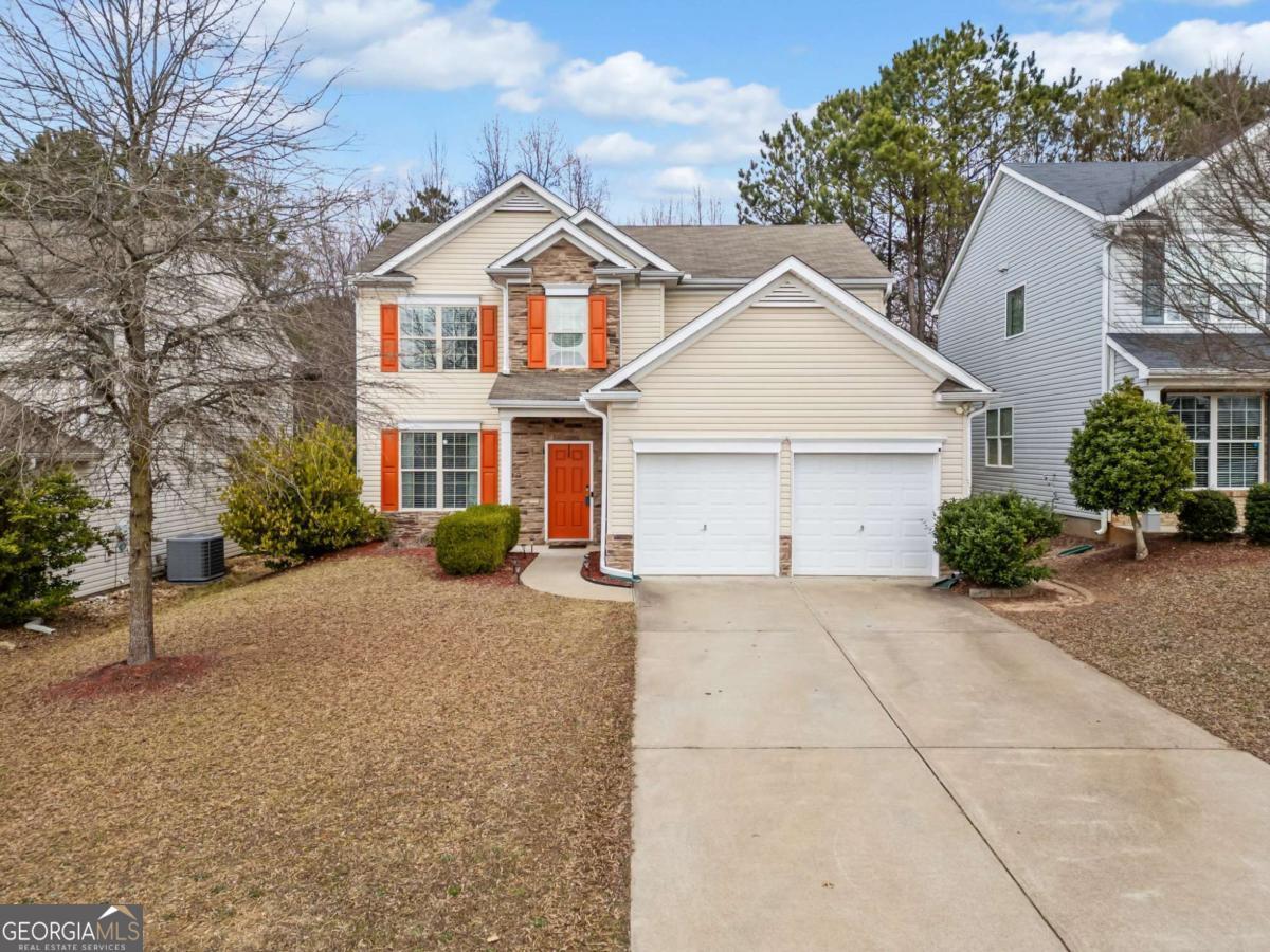 Charming two-story home nestled in the swim & tennis community of Diamond Ridge! As you enter the foyer, an office or flex space is off to the left. As you continue back, you enter the open-concept living, dining, and kitchen areas. The stylish kitchen includes stainless steel appliances, natural countertops, and a pantry. The sunlit dining area is just off the kitchen, with a sliding door for easy access to the back patio. Upstairs, the spacious primary bedroom features a trey ceiling, and the ensuite bath includes a dual vanity, soaking tub, separate shower & large walk-in closet. The three secondary bedrooms with large closets, share a full bath. Outside, enjoy the private low-maintenance backyard on your paver patio overlooking a wooded area. Located in the Cherokee High School District. Convenient to 575, 10 minutes from Lake Allatoona, and 15 minutes from DT Canton.