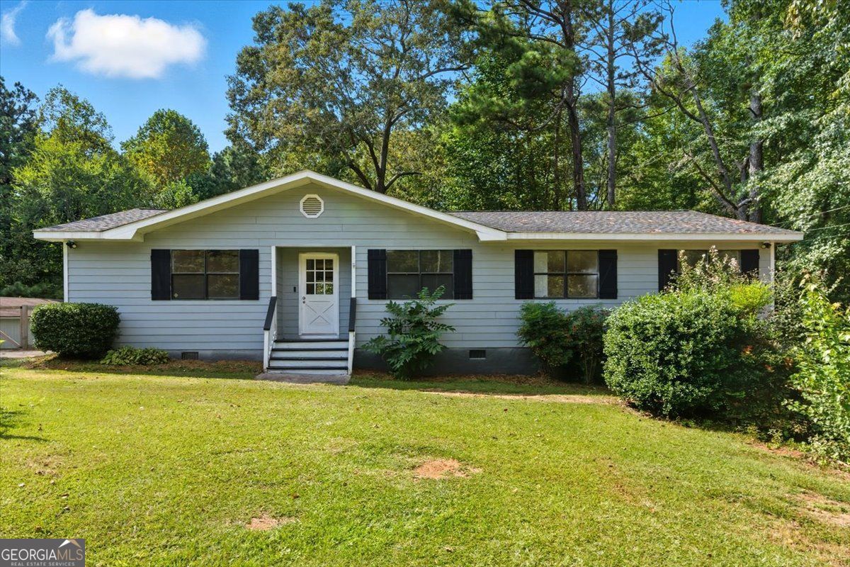 This one level ranch home sits on almost an acre and has a detached workshop with an office! With three bedrooms and two full bathrooms this home has been updated and is move-in ready. Updates over the last couple of years include fresh paint inside and out, new hvac, new roof, new side porch, new bamboo and tile flooring, and more. The peaceful back deck overlooking a wooded lot features an outdoor fireplace that is the perfect spot to enjoy the upcoming fall weather. The detached garage has a climate controlled office and offers a huge space for a workshop or boat/toy storage. This home is a great value so schedule your showing and come see all it has to offer!