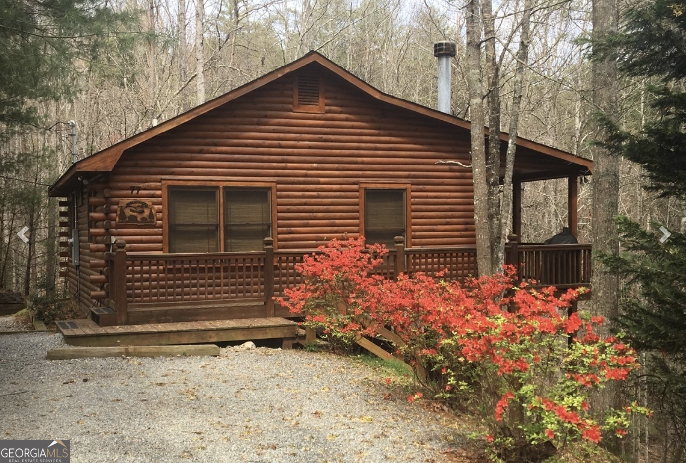 Escape to this adorable log cabin, nestled in a serene natural setting. This quaint and cozy getaway offers the perfect blend of rustic charm and modern comfort. Step onto the inviting front porch, where you can sip your morning coffee while enjoying the peaceful sounds of nature. 2 additional lots also included! Or step inside to nestle around the stone fireplace to relax after a day of outdoor adventures--or better yet, head down to the refreshing hot tub on the lower deck! Located just minutes from hiking trails, fishing spots, and shopping, this log cabin is perfect for an Air B&B, your own private vacation home, or even a full-time escape from the hustle and bustle of the city! Don't miss this chance to own your dream cabin in the woods!