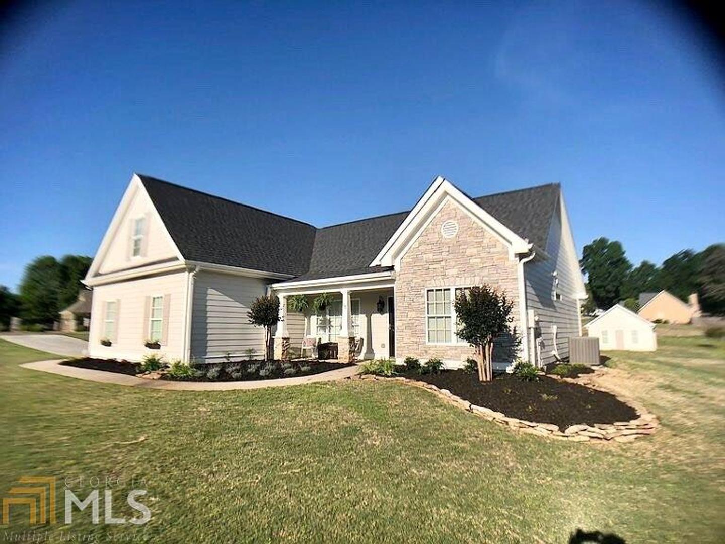 A Stunning Country Farmhouse that sits on a flat.75 acre lot in highly-desired Finch Landing. High end renovations that will leave you breathless. New high quality laminate white oak floors throughout the main level, with many shiplap accents. The den boasts a wall of built-In bookshelves. Gorgeous fireplace with distressed wood mantle and shiplap from floor to ceiling. Open, bright upgraded kitchen with granite-top sink and prep area overlooks the family room and also has incredible views of the property out the back window. Kitchen has exposed wood accents to augmentThe fireplace mantel and includes open shelving, stainless appliances, and spacious pantry with custom doors. Farmhouse dining area holds a large, family table and has judges panel accents to compliment the remainder of the home. Walk out into your new outdoor living space of 20GÇÖ x 12GÇÖ screened-in with high-end lighting and ceiling fans. The owner suite on main with a true spa-like owner suite bathroom, large walk-in closet, custom built-in dresser drawers and high-end fixtures. Shower is beautifully appointed with custom glass enclosure and farmhouse fixtures. Two guest bedrooms on the other side of the house provide privacy and access to their own newly-renovated bathroom with a custom tile and glass shower. Upstairs there is a large bonus room that could be used as an office, another bedroom or craft room; just use your imagination! For the man of the house, there is a 24GÇÖ x 20GÇÖ garage / shop with two man-doors and a garage door entry perfect for the car enthusiast, wood worker, or man-cave escape. This beautiful farmhouse has newer roof and gutters, fresh exterior paint and within walking distance to the pool. Pictures do not depict the quality of this home. Must see!