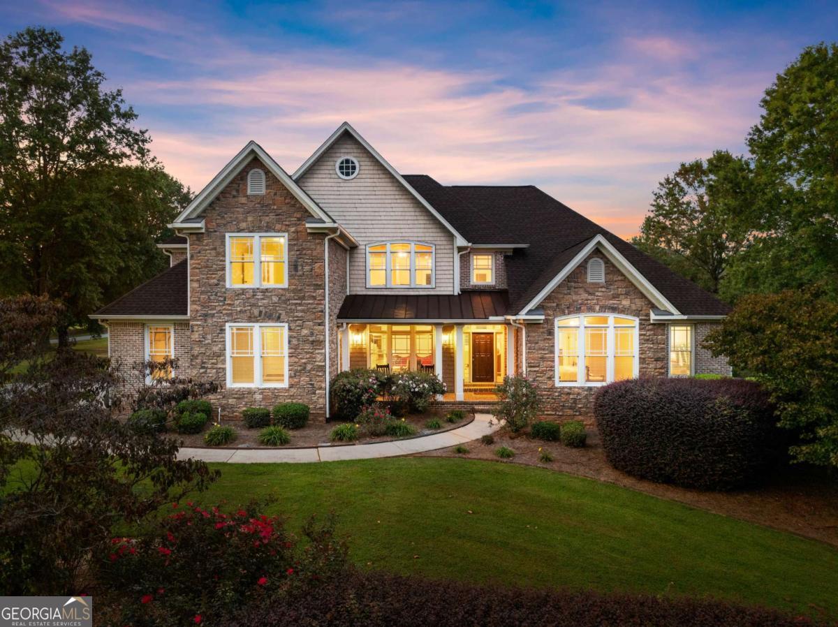 Gorgeous 5 bedroom, 5.5 bath, 5,545 sq ft luxury craftsmen perfectly positioned on the 9th tee box with stunning views of the fairway, green & mountain backdrop. This brick and stone home includes high end finishes with 2-story foyer, formal dining, gorgeous lighting throughout, large kitchen with walk-in pantry & sitting room, stainless appliances & breakfast room, 2 main level fireplaces and a grand living room that is wrapped around the stunning views. The primary suite is oversized and holds a newly renovated primary bath and large walk-in closet! Other rooms include a second master with ensuite on main, upstairs a loft with 2 more bedrooms and updated bathrooms plus a finished terrace level that includes media room, another bedroom and full bath, room for a home gym and a huge golf cart garage. Bonus features include BRAND NEW HVAC, high end epoxied garages, beautiful decking, newly finished second level bath, new roof & gutters, water filtration system, brand new whole house dehumidifier, tons of storage and impeccable landscaping! This 1-acre property is truly one in a million and more importantly the mountain home of your dreams! The Orchard Golf & Country Club is a top of the line, private, 18-hole golf course with driving range, clubhouse & pool! Welcome home!