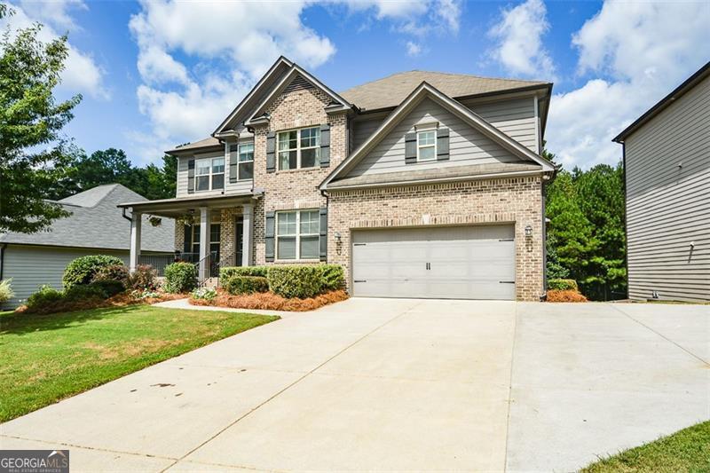 Welcome to this incredible family home located in the Bentwater Golf and Country Club community with access to the best amenities and fabulous North Paulding schools! The home sits on a beautifully landscaped lot with a huge, private, and fenced backyard. Inside, the striking floor plan offers a formal living room/study, banquet-sized formal dining room, enormous chef's kitchen with beautiful granite countertops, oversized island, and breakfast area, main-level guest suite, and more. There is a curved wall of windows in the huge family room overlooking the extended deck and backyard area. Upstairs, double doors lead to the luxurious and massive master suite with a spa bath featuring a garden tub, spacious shower, and double vanities with tons of extra counter space. The huge master closet is super impressive with space galore. Also, there are three additional bedrooms on this level, all with walk-in closets and private bath access. The laundry room is also on this level for added convenience. The finished terrace level makes a perfect in-law or teen suite. It features a spacious bedroom, private bathroom, enormous walk-in closet, second room perfect for a workout area or second bedroom, office area, storage rooms, and a living/media room with a kitchenette area and curved wall of windows overlooking the patio and backyard. This home offers an expansive layout, and is designed for both warmth and space!