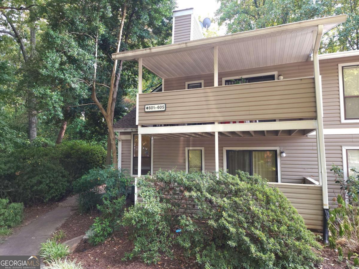 Beautifully updated 2BR/2BA condominium in a desirable East Cobb swim/tennis community with an excellent location for city commuting. This ground-floor unit features a private back-corner entry with no upstairs neighbors and a covered balcony perfect for morning or evening relaxation. The kitchen is equipped with all new stainless-steel appliances, granite countertops, and updated cabinets, while a separate laundry room with washer and dryer adds convenience. Community amenities include a saltwater pool, tennis courts, and a gas grill area, with garage parking and plenty of guest spaces available. Enjoy easy access to I-75 and the HOV express lanes, as well as nearby walking and running trails along the Chattahoochee River. The home is just few minutes from The Battery/Braves Stadium, Cumberland Mall, and a new retail development across the street with restaurants, shopping, and LA Fitness. HOA covers water and trash. Furniture in the pictures can be included with the rental (bedroom TV excluded). No smokers, no pets.