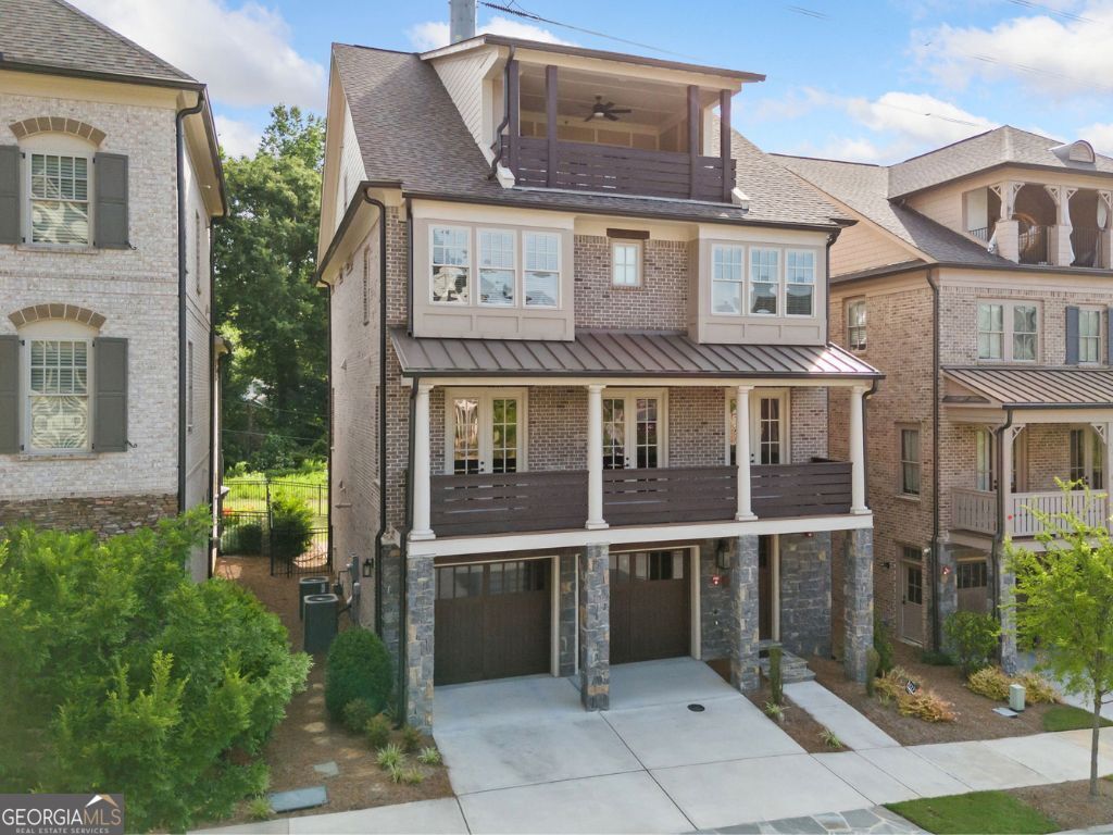 Step into luxury living just minutes from downtown Atlanta and Buckhead in this beautifully crafted 5-bedroom, 5.5-bath single-family home located in the exclusive Enclave on Collier. This boutique John Wieland collection offers a gated, serene community filled with upscale amenities and timeless design. As you enter the home, you're greeted by an elegant foyer and easy access to the terrace level, where you'll find a bedroom with an ensuite bath, a kitchenette, and access to the covered patio and fenced backyard, perfect for guests, a private office, or multigenerational living. There is also a mudroom, and the garage is thoughtfully outfitted with a slat wall, extra shelving, and built-in storage to keep everything organized. Take the elevator (servicing ALL floors) or stairs to the main living level, where you'll find two spacious living rooms, one featuring built-in bookshelves flanking a cozy fireplace. The chef's kitchen is a showstopper with top-of-the-line stainless steel appliances, including a 6-burner Thermador range and microwave drawer, quartz countertops, an oversized island open to the keeping room and breakfast area, and a walk-in pantry with its custom wine rack. Also on this level: a guest bedroom, full hall bath, and a formal dining room/library that opens via three French doors to the full-length front porch overlooking an acre of greenspace. The owner's suite on the third floor includes a spa-like bathroom with a freestanding tub, dual vanities, two private water closets, and two custom closets with dressing areas. Two additional bedrooms complete this floor, each with an ensuite bath and a convenient laundry room. The fourth level offers a large media room with built-in speakers, tech closet, wine fridge, guest suite with full bath, and access to a sky terrace with fireplace, perfect for entertaining. Community amenities include gated entrances, a one-acre central park with a gathering pavilion and fireplace, and a neighborhood dog park. Located less than a mile from shopping and dining, Bitsy Grant Tennis Center, Bobby Jones Golf Course, the Atlanta BeltLine Northside Trail, and Atlanta Memorial Park.