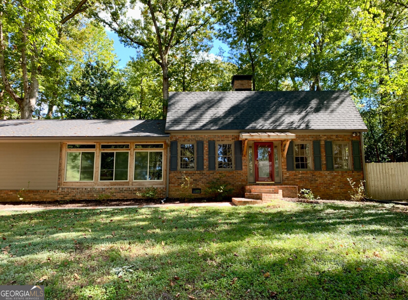 Charming 3BR/2BA | 2,220 Sq Ft | 1st Floor Master | East Cobb Location Discover this beautifully maintained 3BR, 2BA home nestled in a quiet, tree-lined neighborhood-just one exit outside the Atlanta perimeter. Classic brick exterior, mature landscaping, two car attached garage, spacious corner lot. The two story house is filled with natural light and has a highly desirable main-level master suite with an exquisite new walk-in shower. Large, eat-in kitchen, den with fireplace, and two bedrooms with a shared bath on the second level. Fenced-in backyard with large deck and tool shed. Updates include: 8-yr roof, 3-4yr HVAC, 3-yr water heater, 2-yr Electric panel, 1-yr garage door opener. This diverse, friendly community features a voluntary HOA/year. Optional swim/tennis club includes Olympic-size pool, tennis courts, and clubhouse. Very walkable neighborhood is ideal for outdoor lovers and pet owners. Districted schools include Brumby Elementary and East Cobb Middle (.5 mi), with Wheeler High (Magnet) nearby. Easy access to I-75/I-285. Close to outdoor recreation such as Terrell Mill Park (0.5 mi) Sope Creek historic Paper Mill ruins (1.5 mi), and the Battery and Truist Park (X mi).