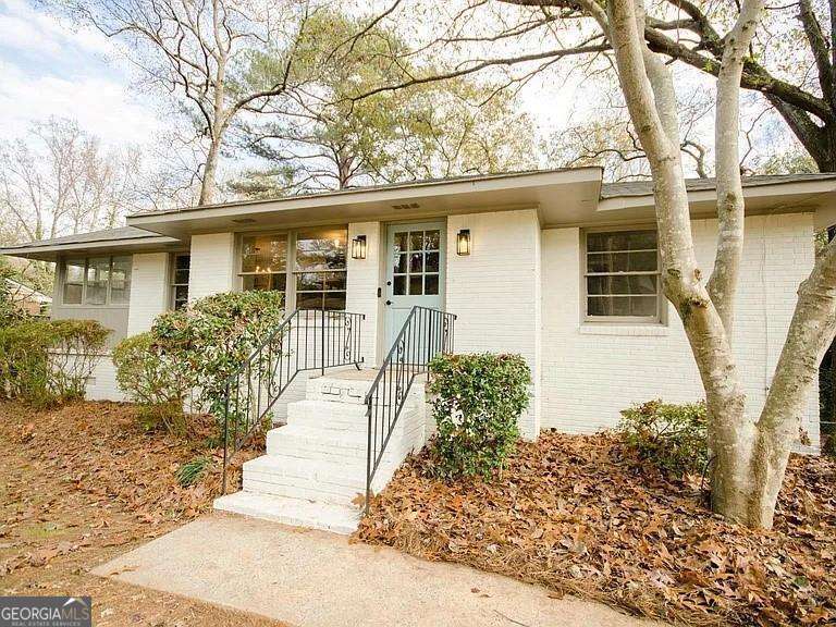 Beautifully renovated 3 Bedroom/1 Bathroom ranch available for immediate move-in! Newly renovated kitchen features brand new kitchen cabinets, quartz countertops, and new appliances. Open concept living with the living room open to the dining room, which flows into a sunroom and back deck - great for entertaining! Home features hardwood floors throughout, a new HVAC, and an updated bathroom. The full unfinished basement has tons of storage, as well as room for 1 car in the garage, and laundry hookups. The backyard is flat, very large, and fully fenced in! This home is located on the Smyrna/Marietta border, with easy access to Marietta Square shops/restaurants, Smyrna Market Village shops/restaurants/greenspace/library/community center, and Truist Park (Braves stadium) & the Battery. Pets welcome with a $500 nonrefundable pet fee. Apply today!