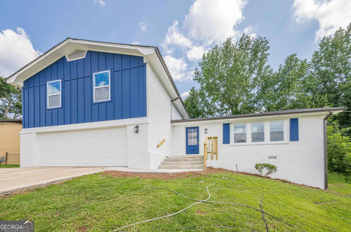 Fully Renovated Home with 4 Bedrooms & 3 Full Baths! Step into this stunning, completely remodeled home featuring solid hardwood floors and LVP flooring on the lower level. Everything is NEW: HVAC system with all-new ductwork, plumbing, electrical system, and water heater-offering peace of mind and modern efficiency. The kitchen is a true showstopper, boasting quartz countertops, white shaker cabinets, a center island, and brand-new stainless steel appliances-perfect for entertaining and daily living. The open-concept living room is filled with natural light and features a beautiful electric fireplace that adds warmth and style. The spacious master suite features a walk-in closet and a luxurious en-suite bathroom, complete with a double vanity and a designer tile shower. All three bathrooms are fully updated with modern tile finishes throughout. Additional highlights include: new windows and doors, a 2-car garage, and a huge backyard-ideal for outdoor gatherings and family fun. Don't miss this opportunity to own a turnkey home with top-to-bottom updates!